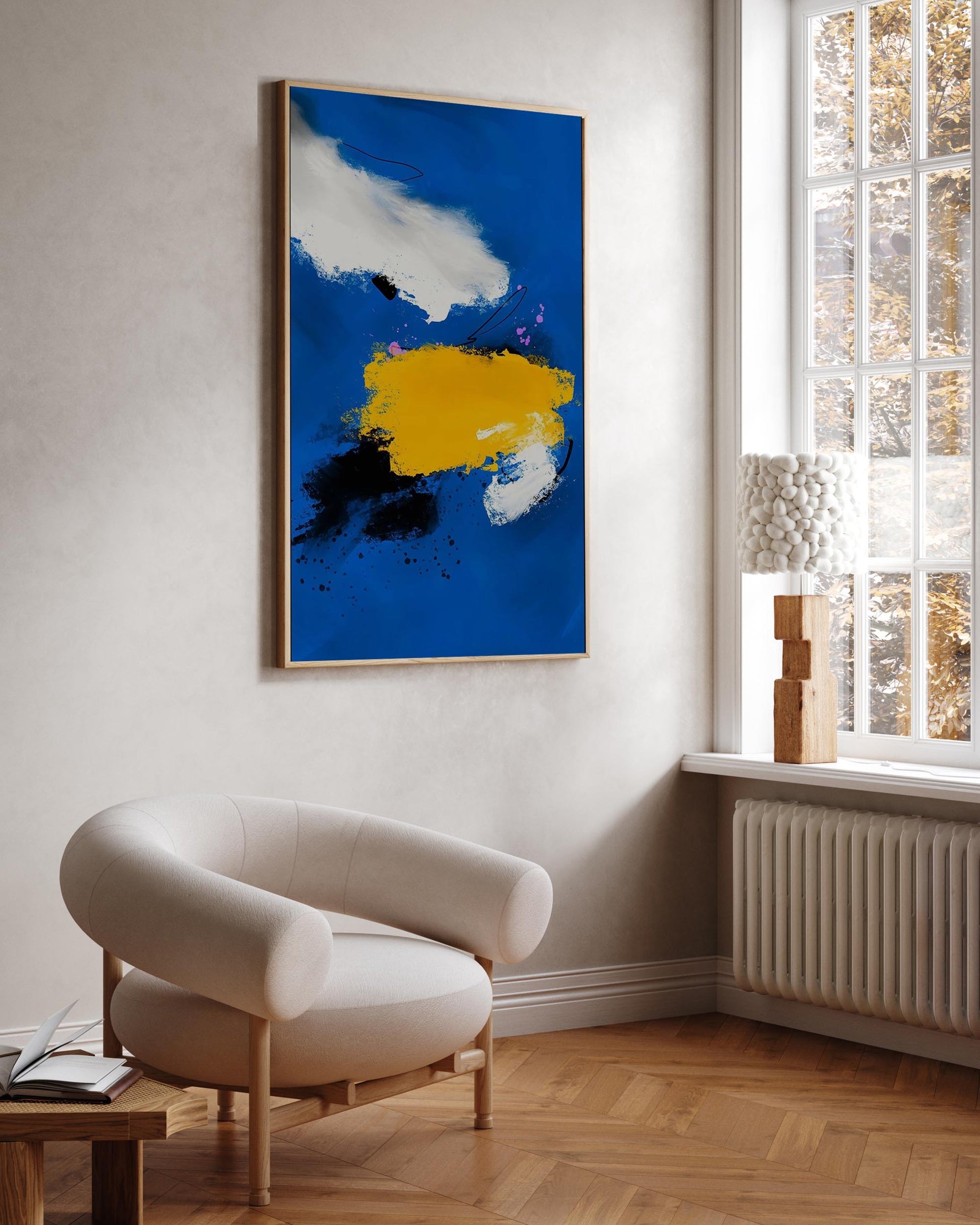 blue vibrant modern wall art in contemporary chic beige Scandinavian living room with statement boucle chair.