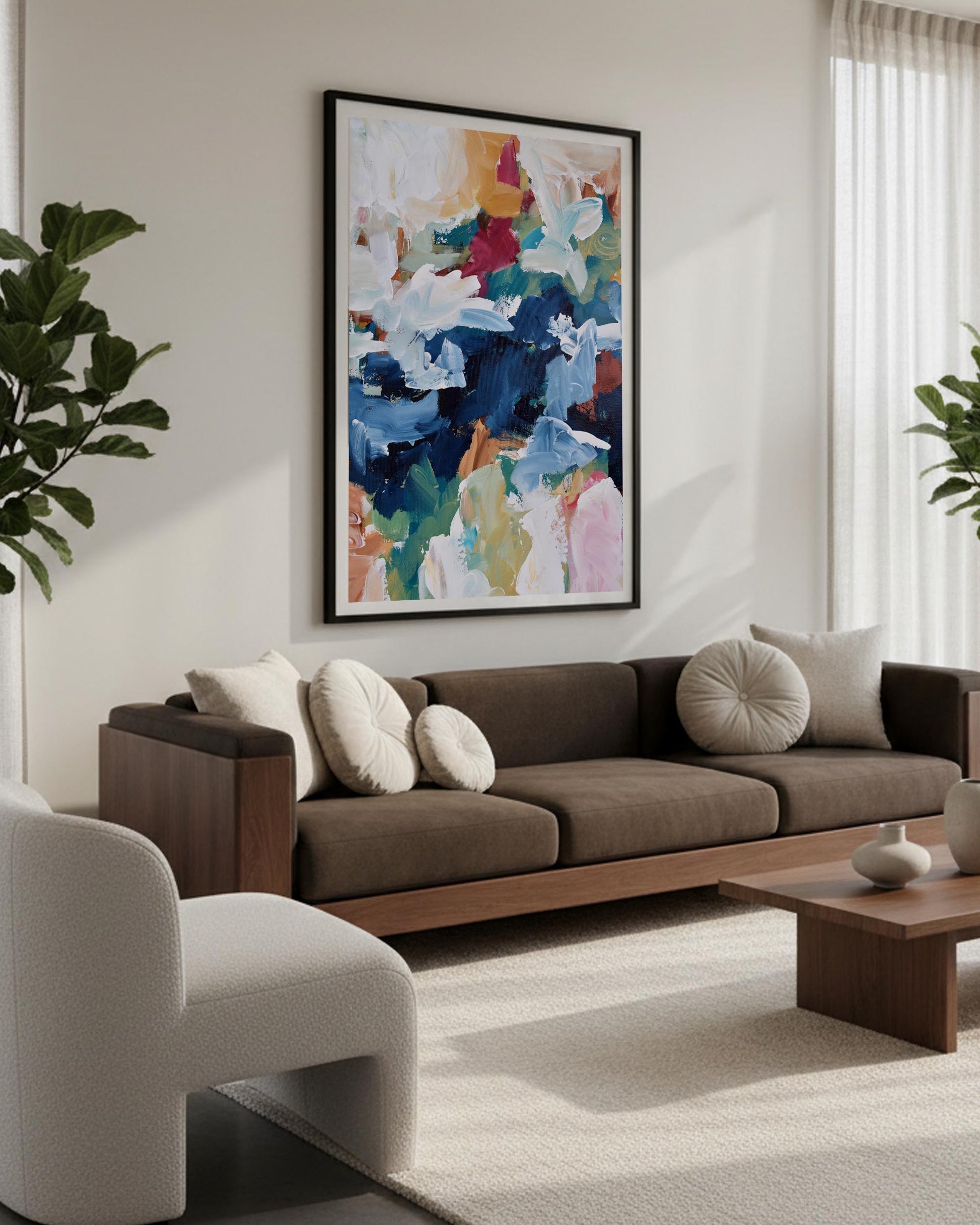 Modern living room with a brown sofa, abstract art, and decorative items.