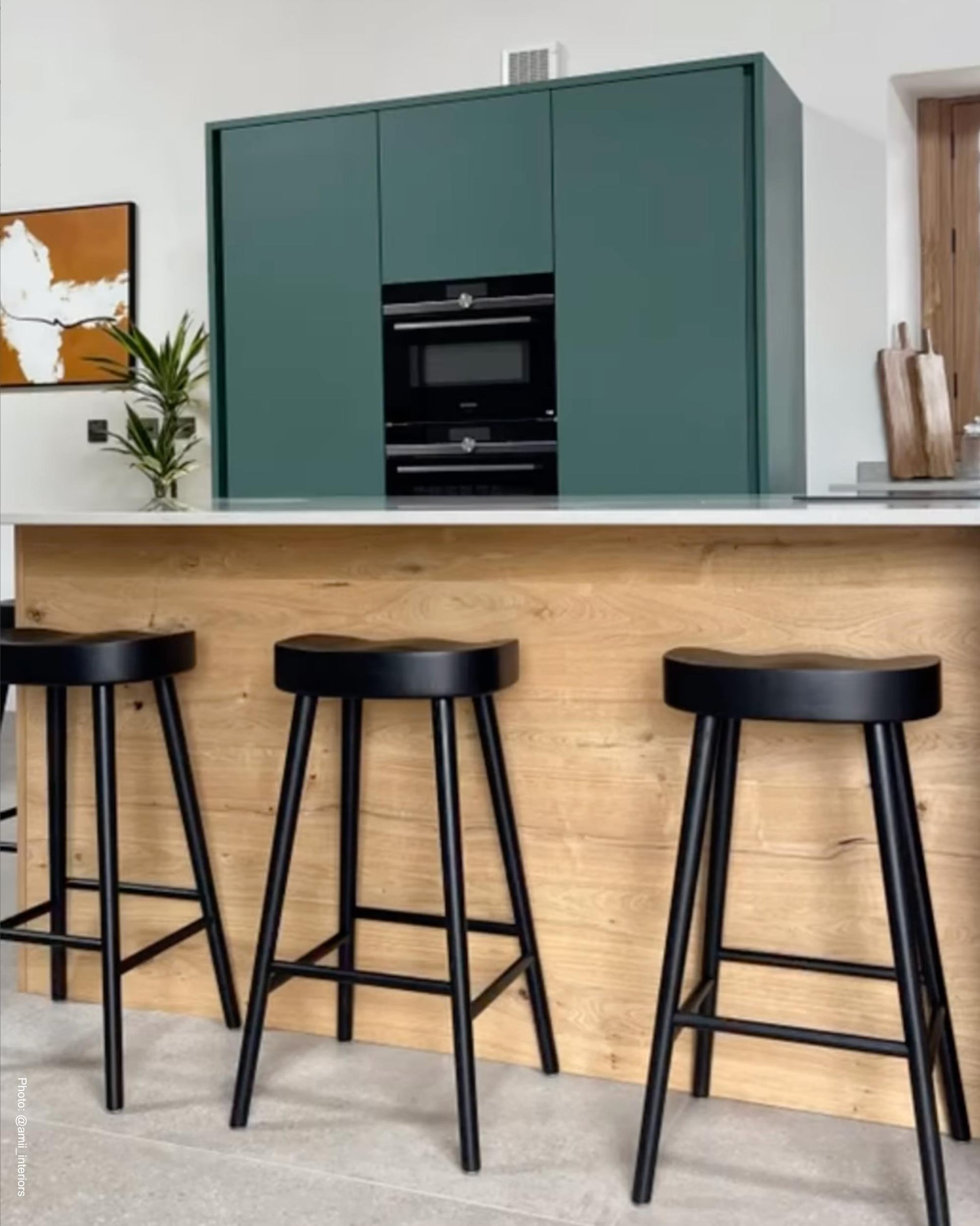 Large orange canvas wall art print in modern scandinavian oak wood kitchen