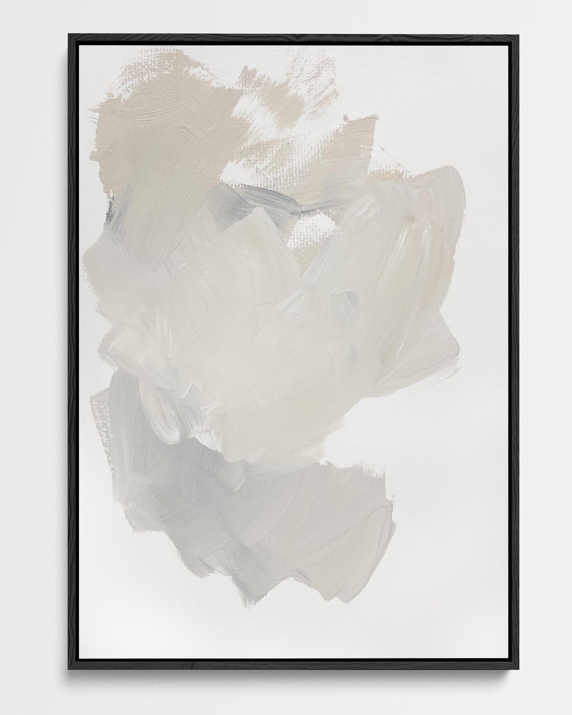 Abstract art print in a black frame on a white wall