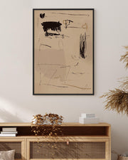 Abstract artwork on a beige wall above a wooden console table.