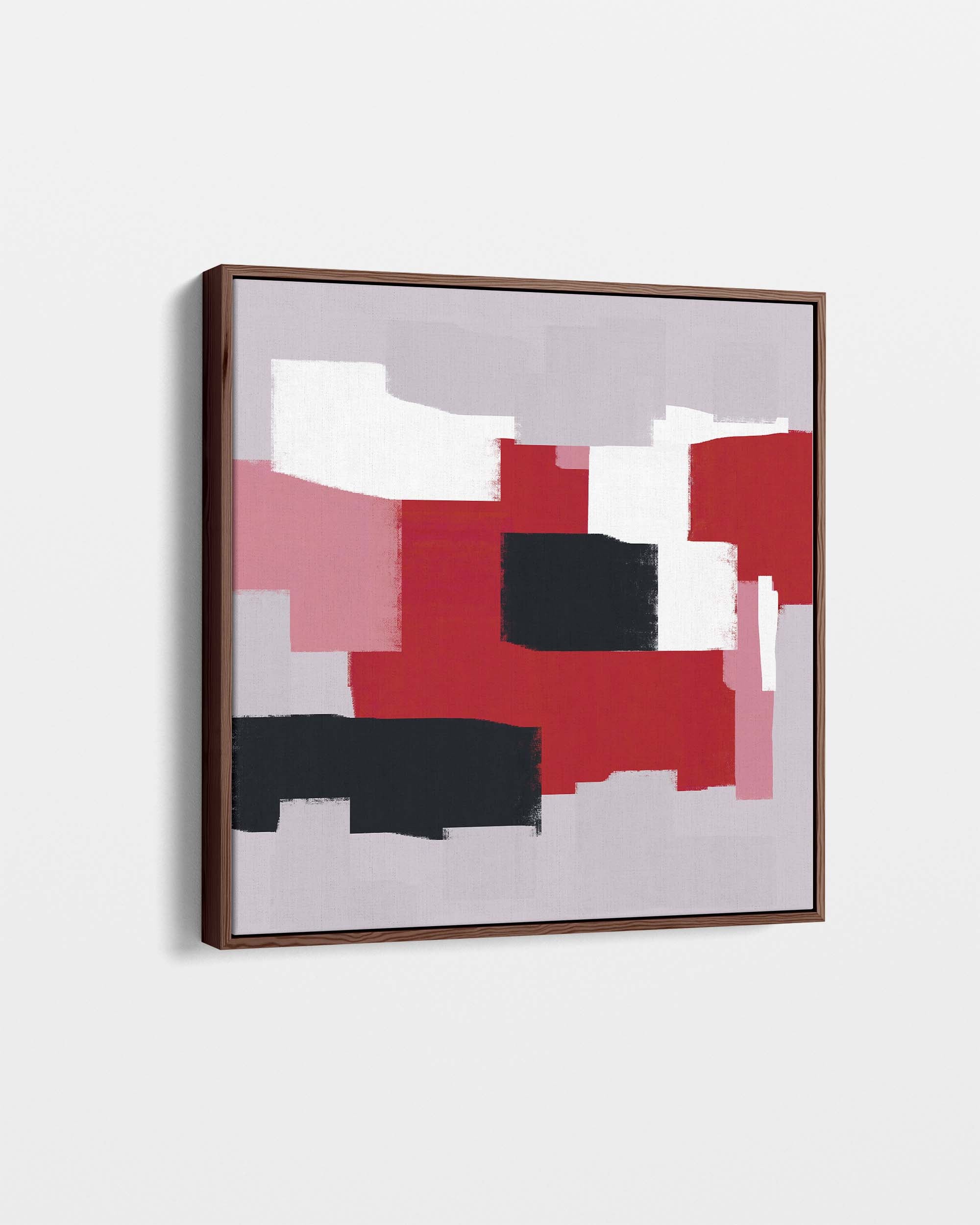 Framed abstract art with red, black, and pink colors on a light gray background