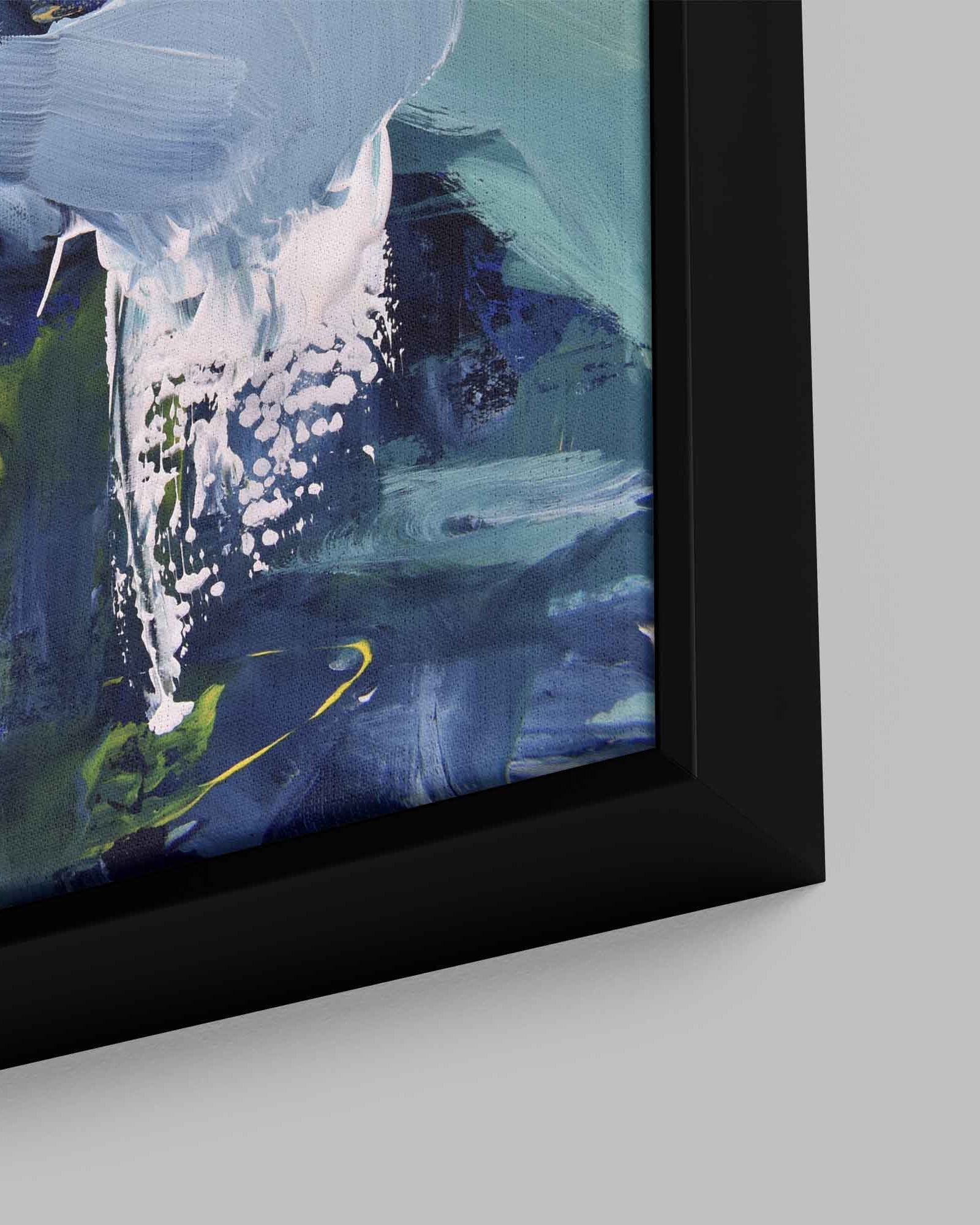 Framed abstract painting with blue and green tones on a light gray wall.