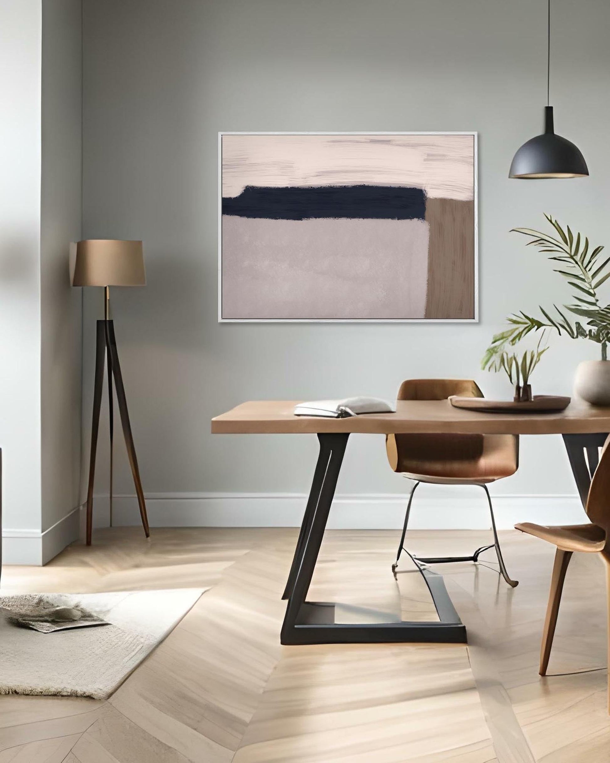 Modern interior with a wooden dining table, chairs, abstract art, and decor items.