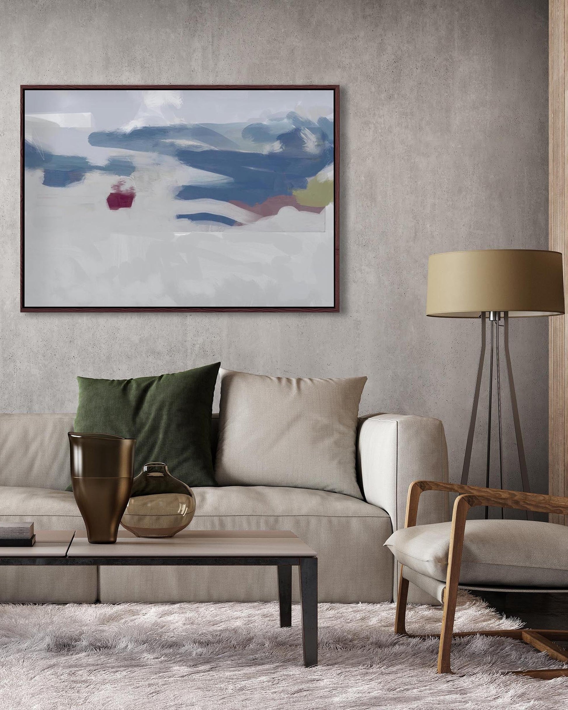 Modern living room with a gray sofa, abstract painting, and decorative items.