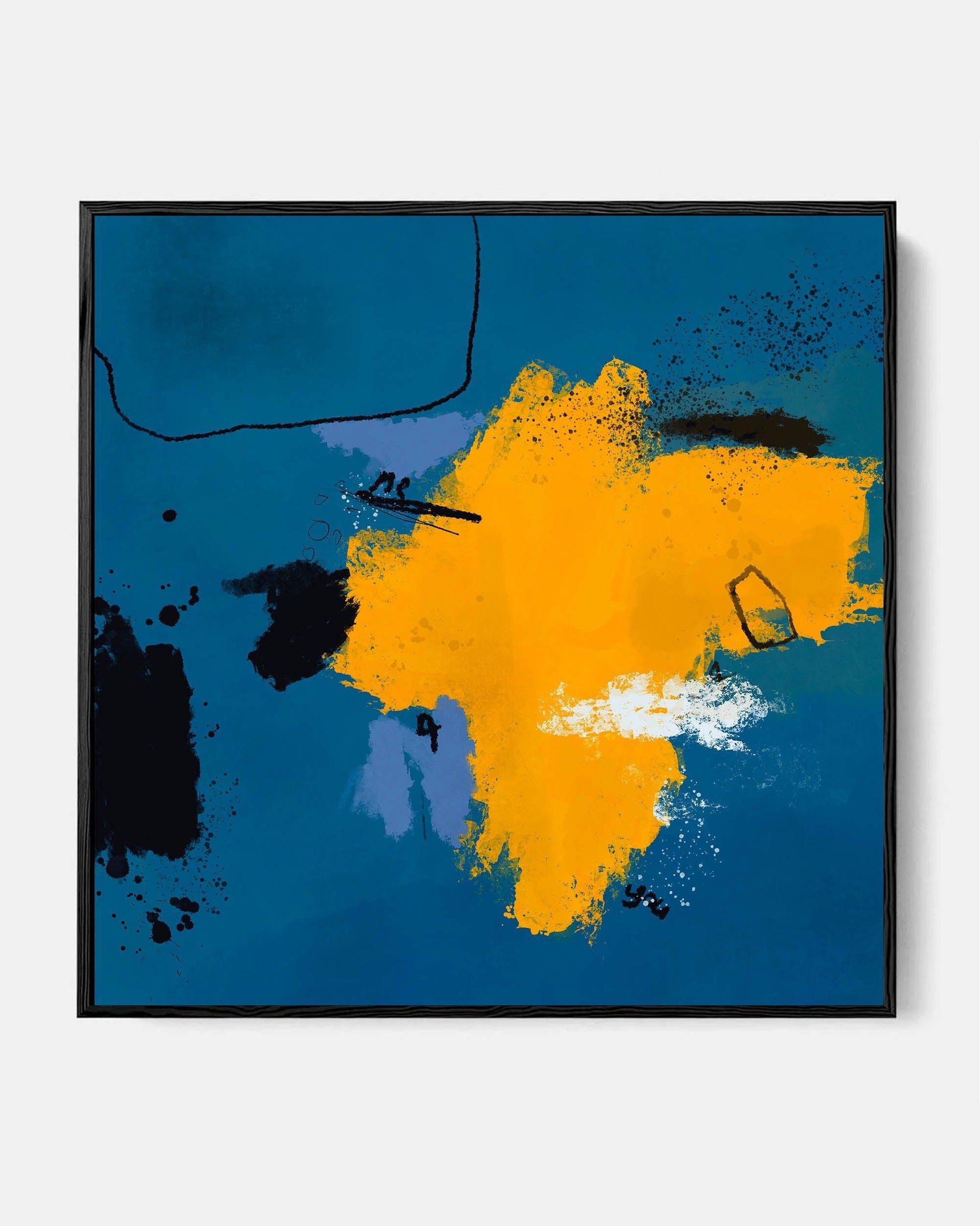 Framed canvas wall art featuring an abstract design with blue and orange colors, displayed above a sofa in a living room setting.