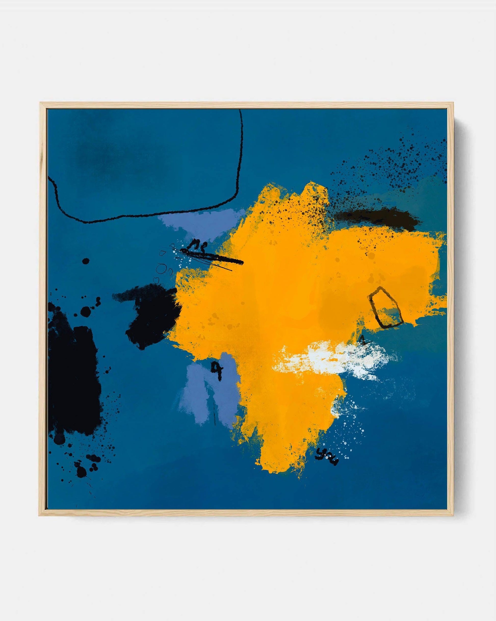 Framed canvas wall art featuring an abstract design with blue and orange colors, displayed above a sofa in a living room setting.