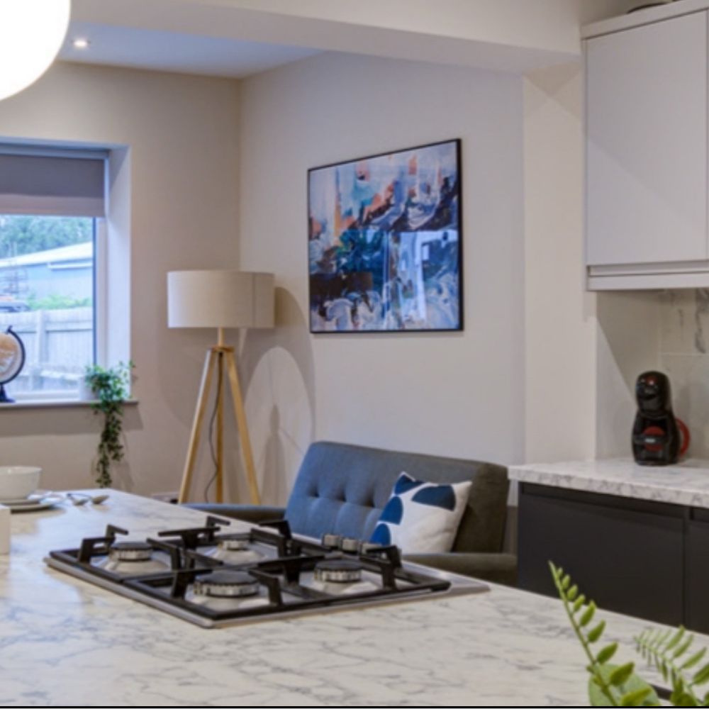 Large framed blue abstract artwork in the kitchen 