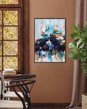 Abstract painting on a wall in a room with a window and plant