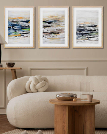 Japandi living room decor. Modern living room with a beige sofa, wooden coffee table, and abstract art on the wall.