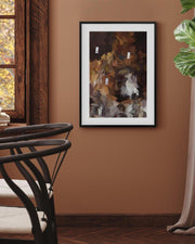 Abstract painting on a wall in a room with a chair and plant