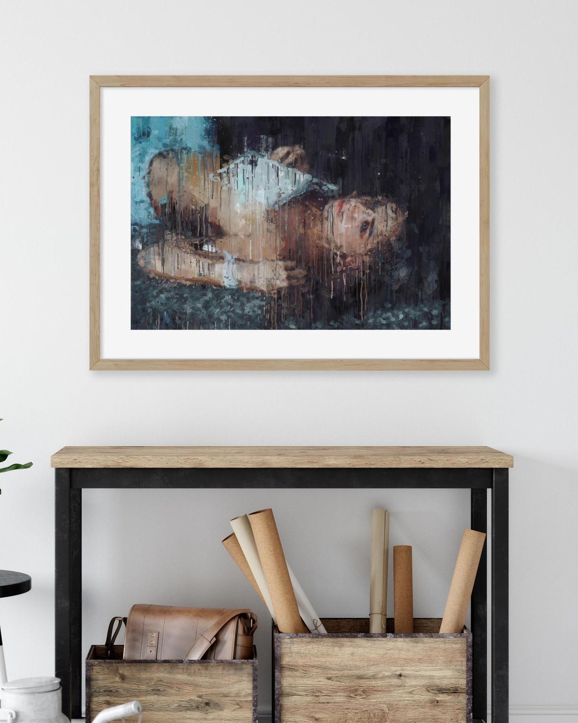 Framed abstract painting on a wall above a console table with decorative items.