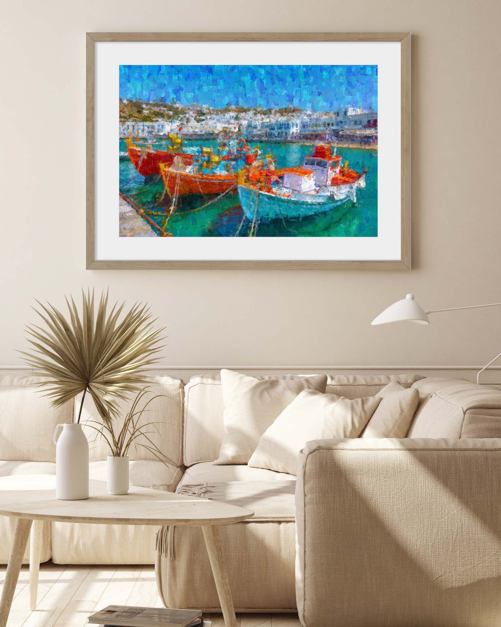 Framed artwork of a harbor scene with boats in a living room.
