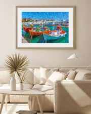 Framed artwork of a harbor scene with boats in a living room.