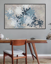 Dining room with wooden table, chair, and abstract floral artwork on the wall.