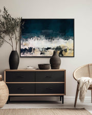 Modern interior with a dresser, abstract painting, and decorative items.