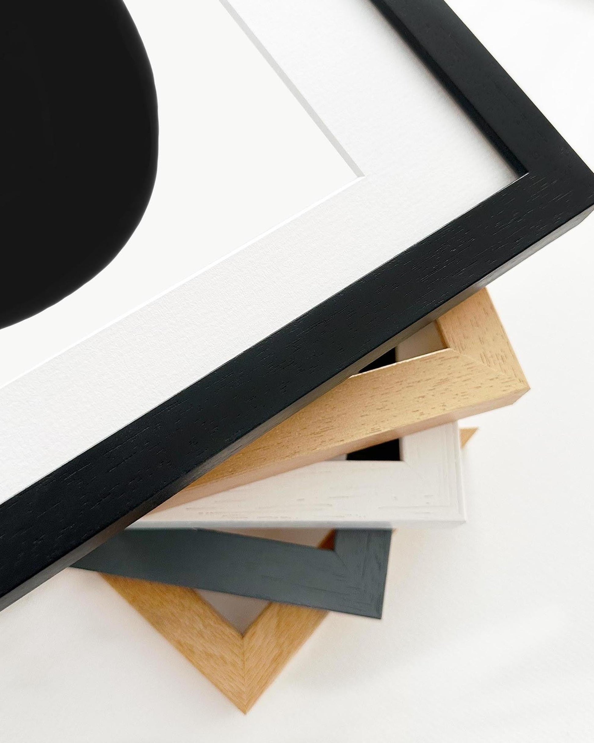 Collection of various wooden picture frames on a white background