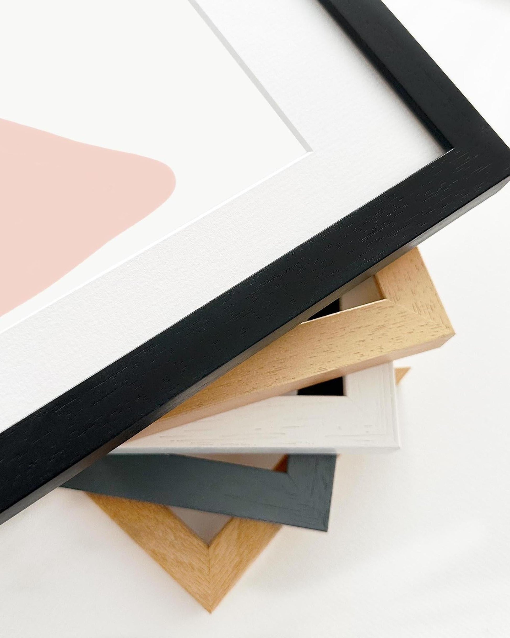 Collection of variously colored picture frames on a white background