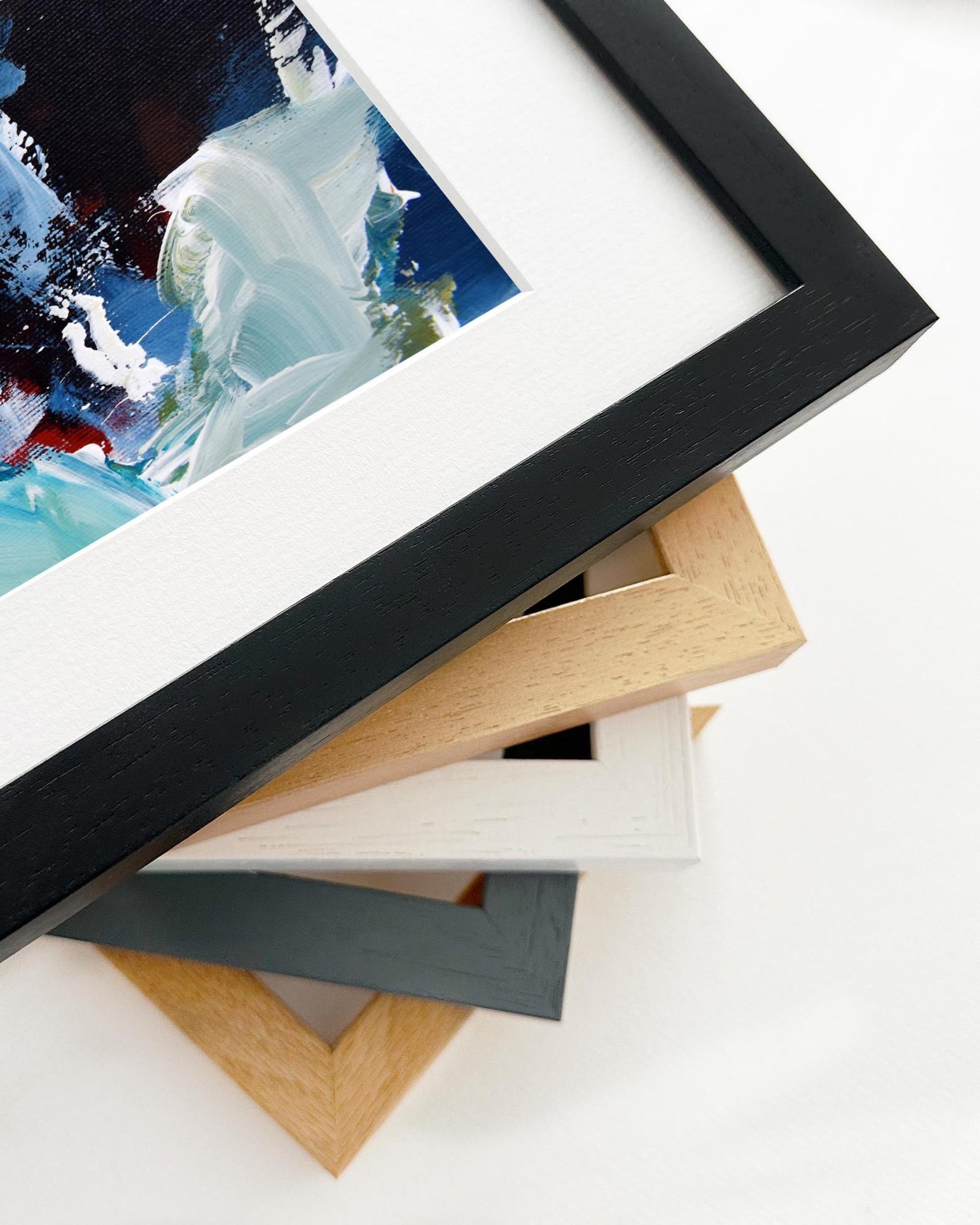 Stack of various photo frames on a white background