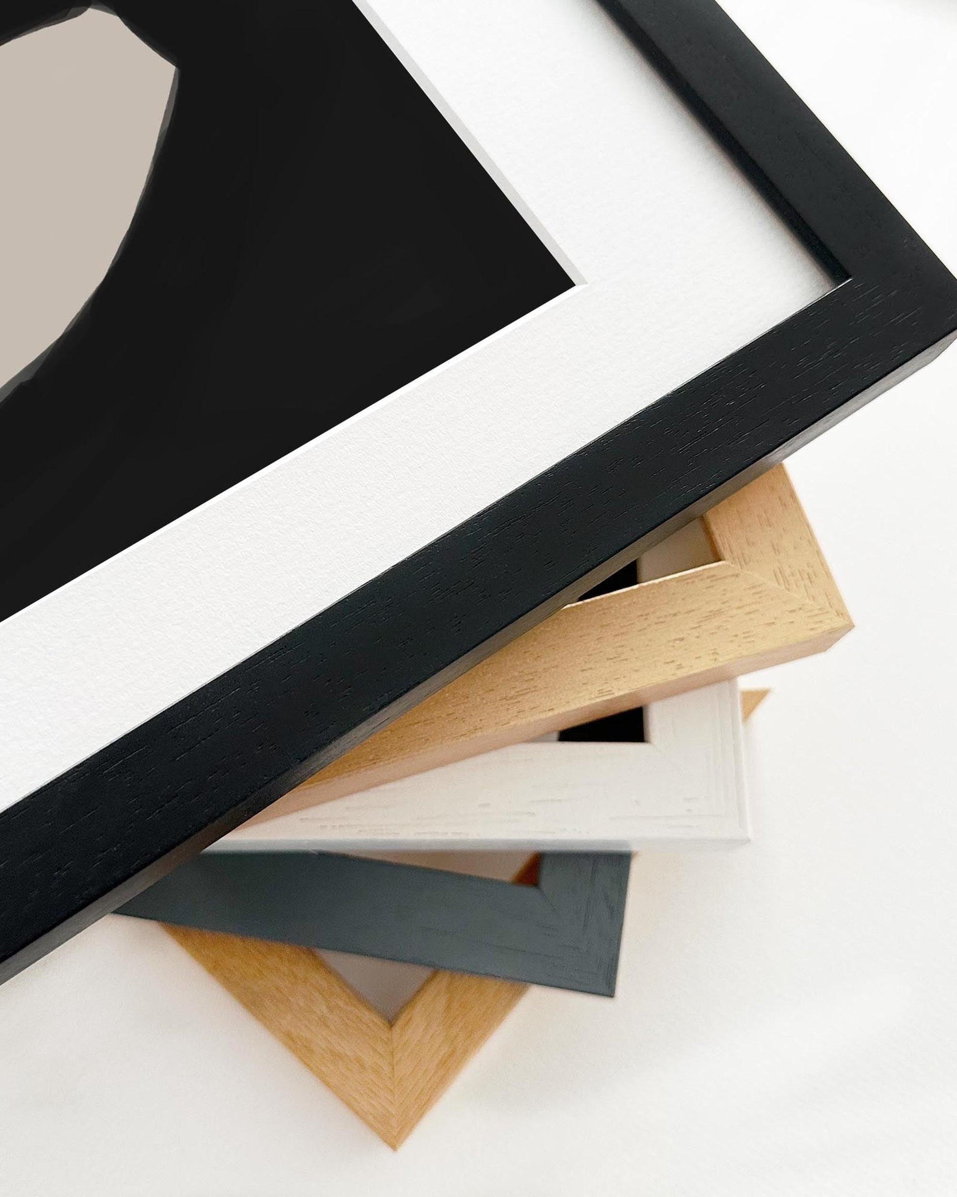 Collection of various wooden picture frames on a white background