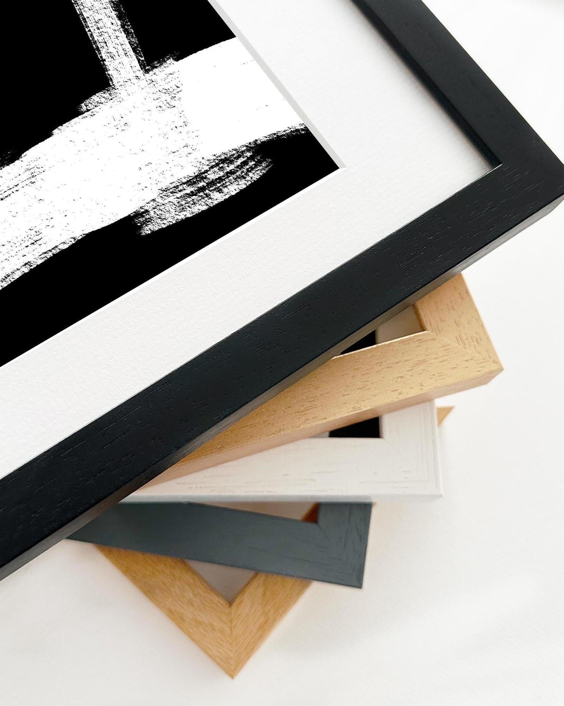 Collection of variously colored picture frames on a white background