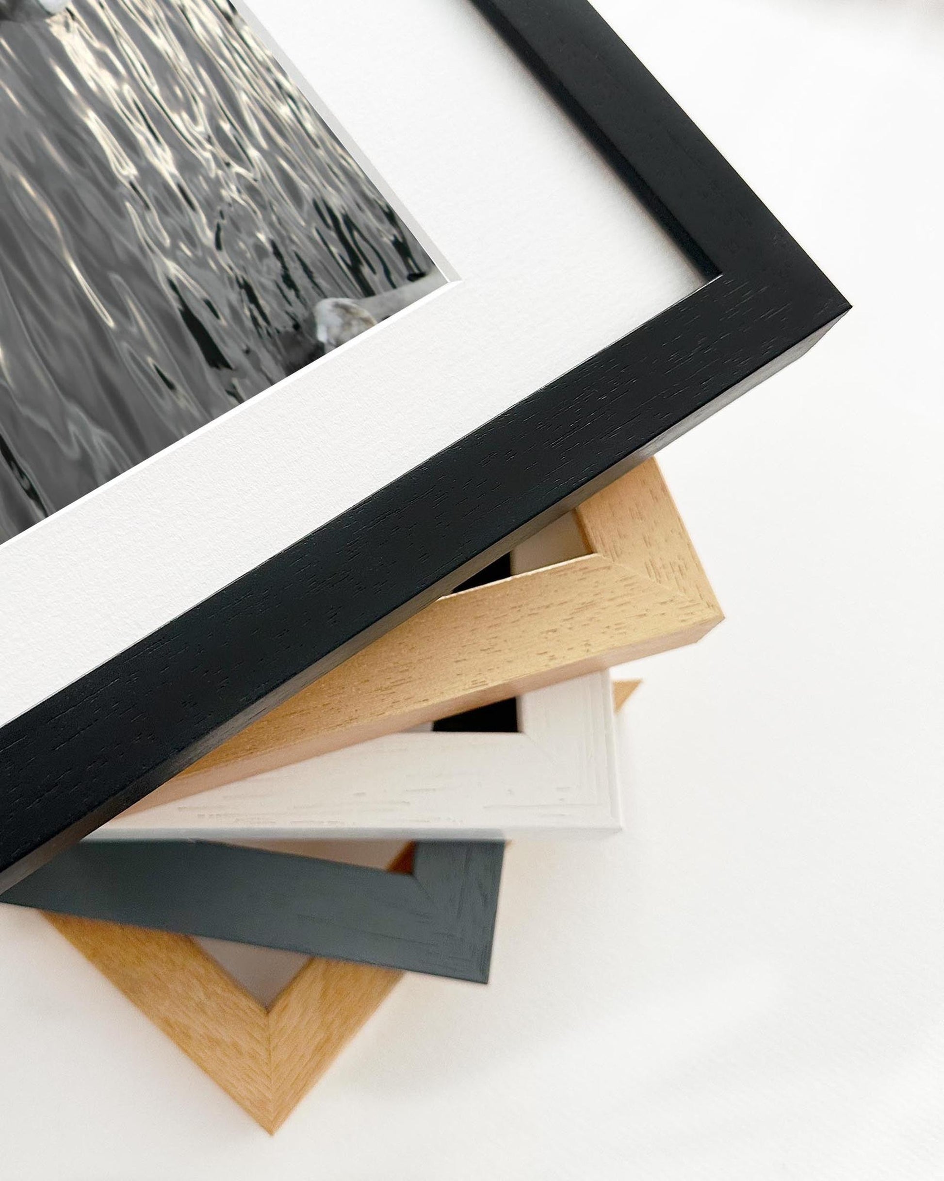 Collection of variously colored picture frames on a white background