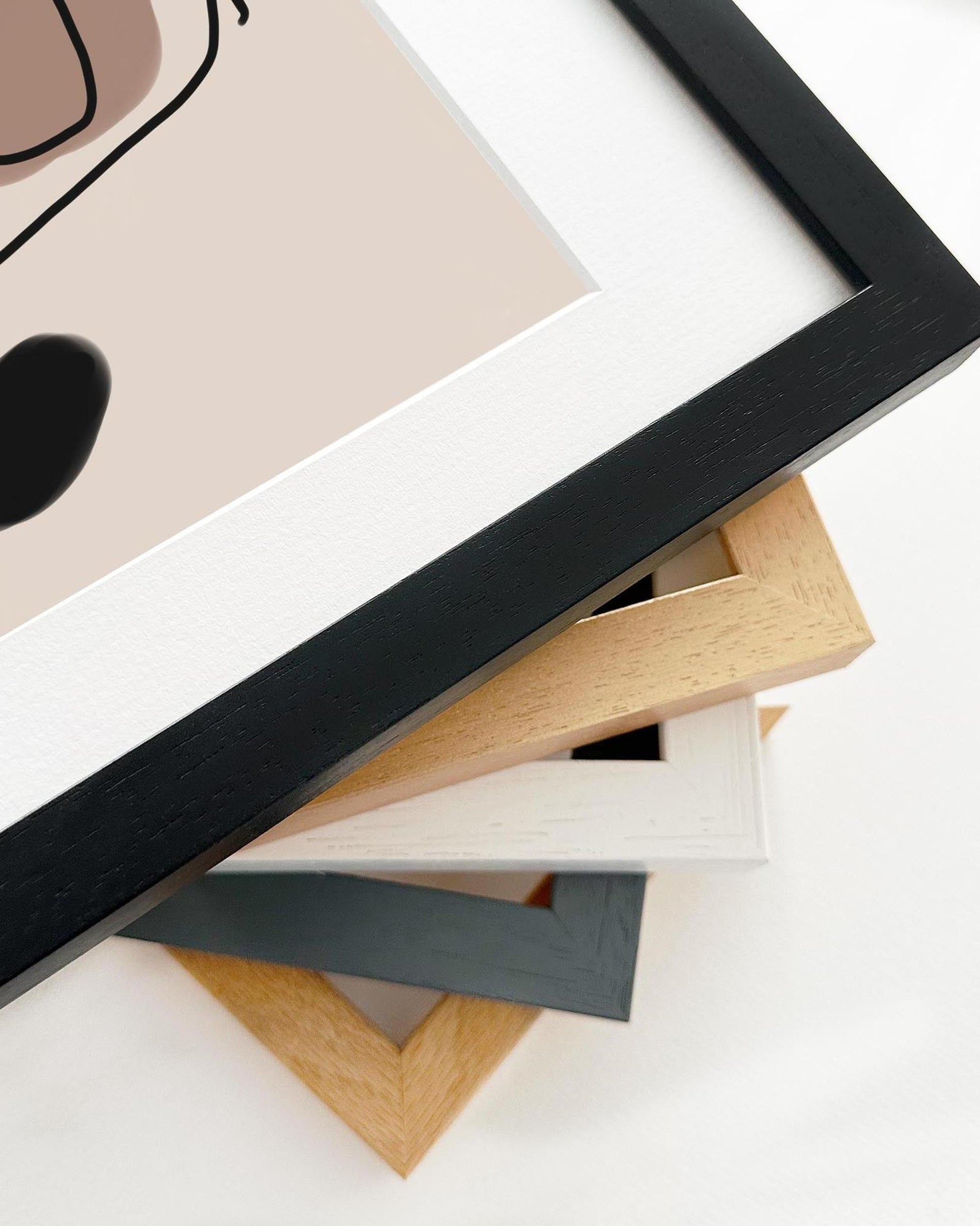 Collection of various wooden picture frames on a white background