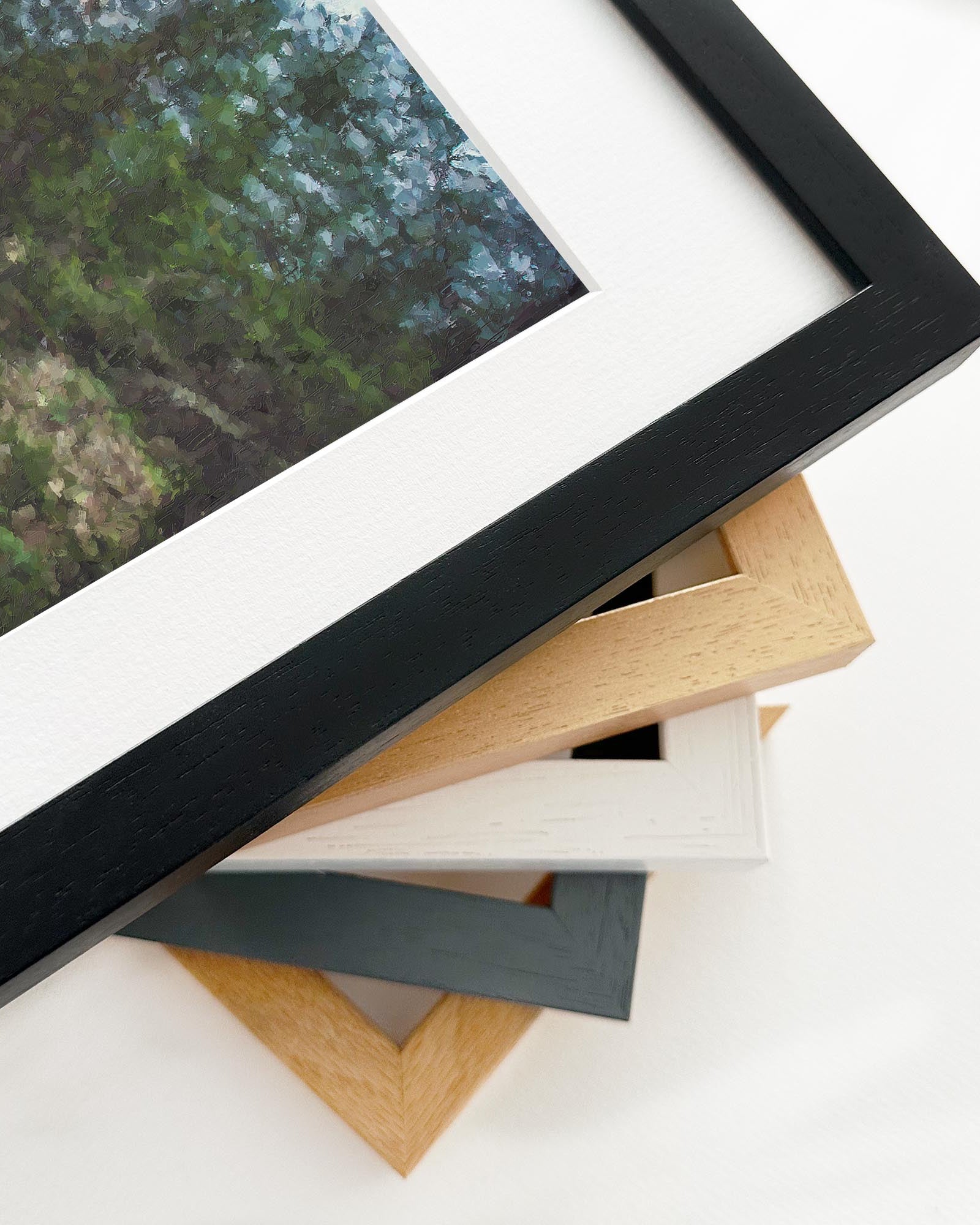 Collection of picture frames in various colors on a white surface