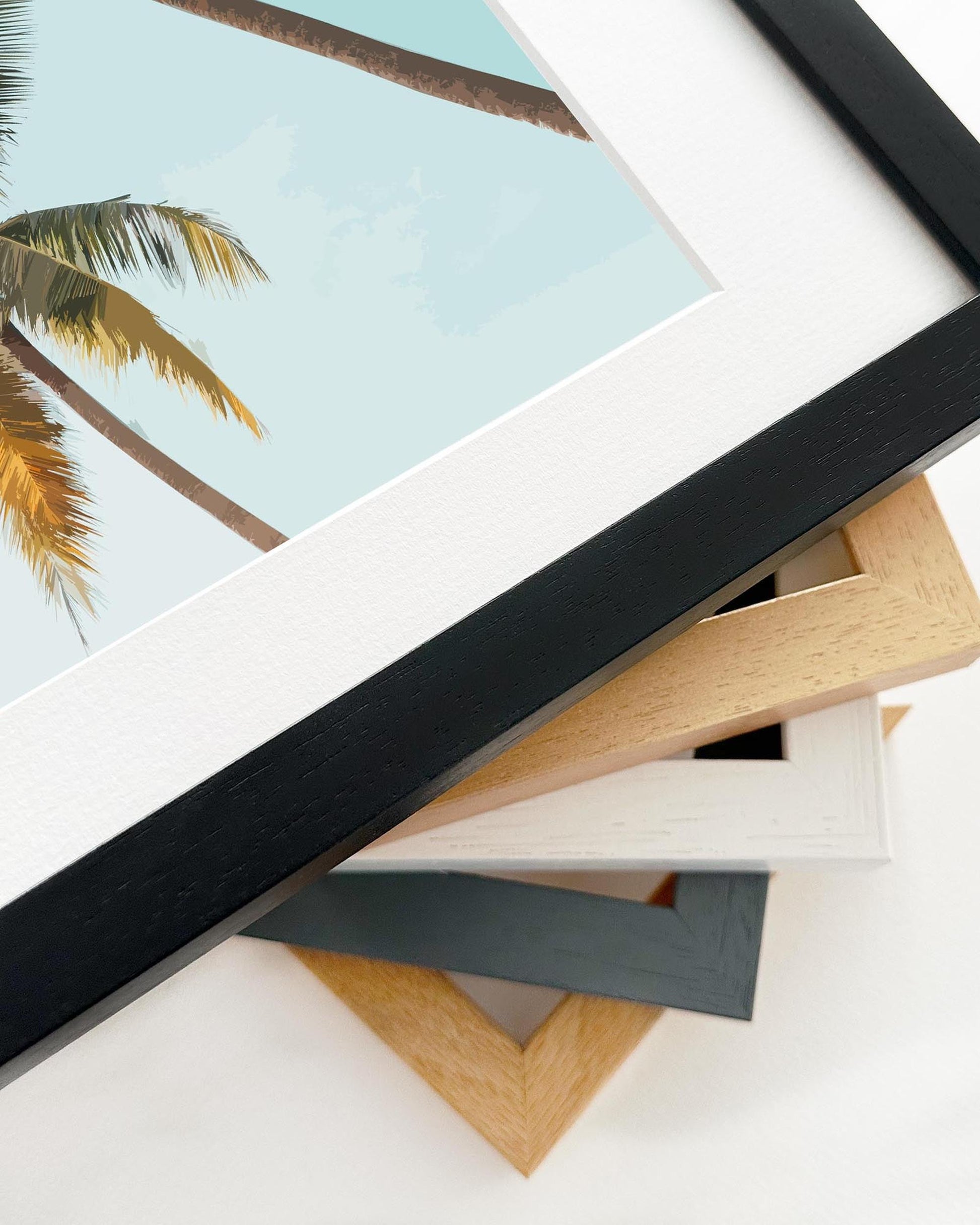 Stack of variously colored picture frames on a white background