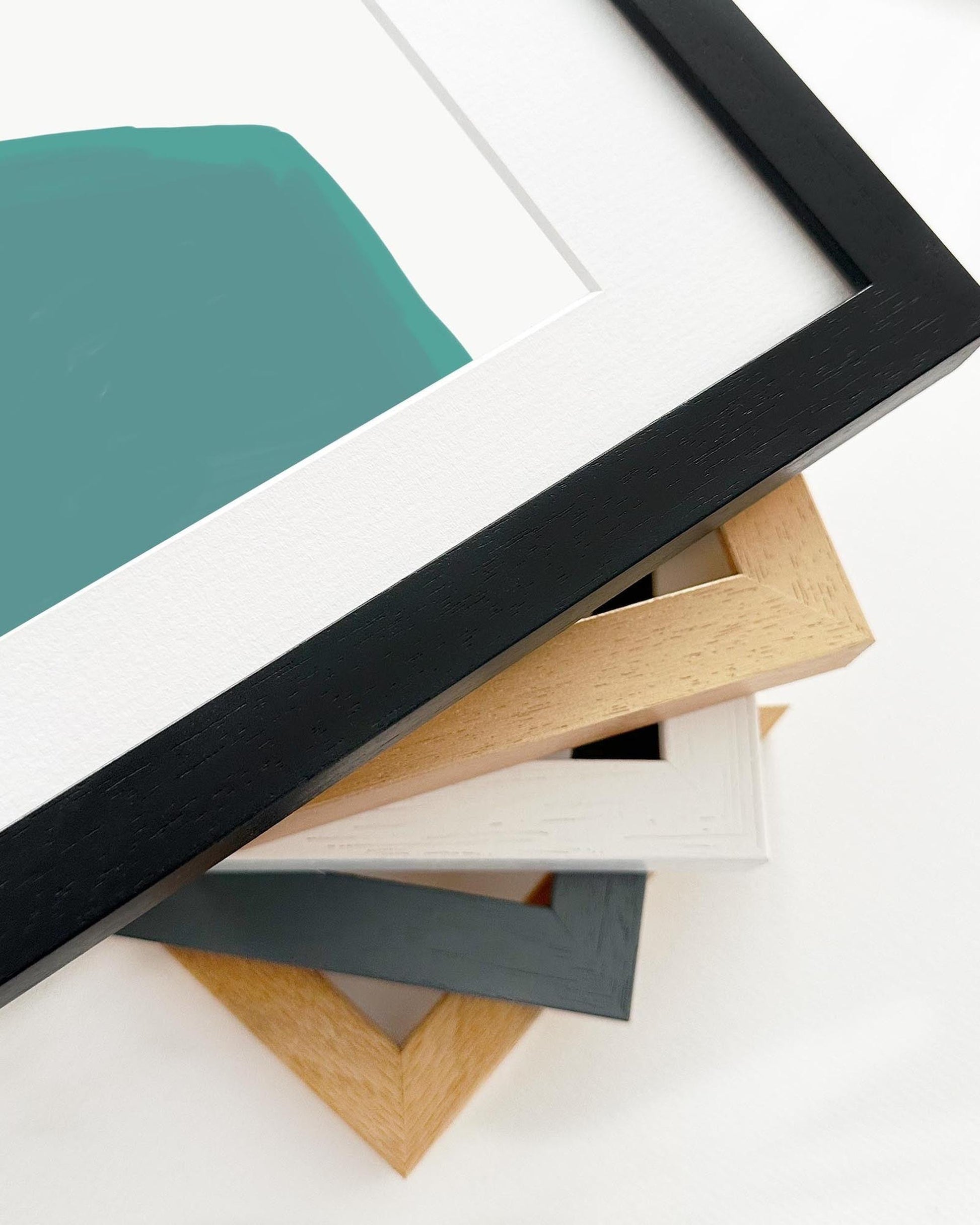 Collection of variously colored picture frames on a white background