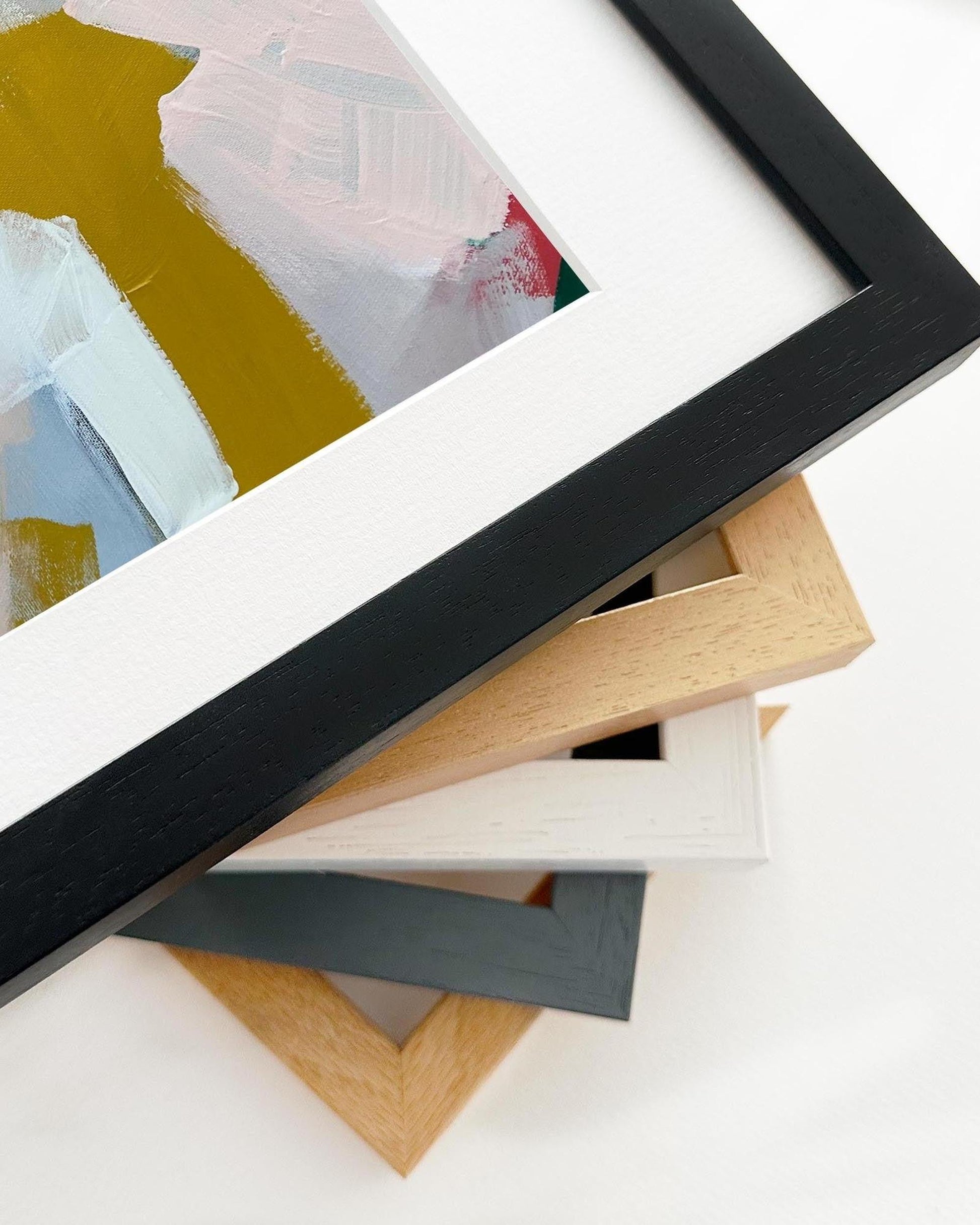 Stack of various picture frames on a white background