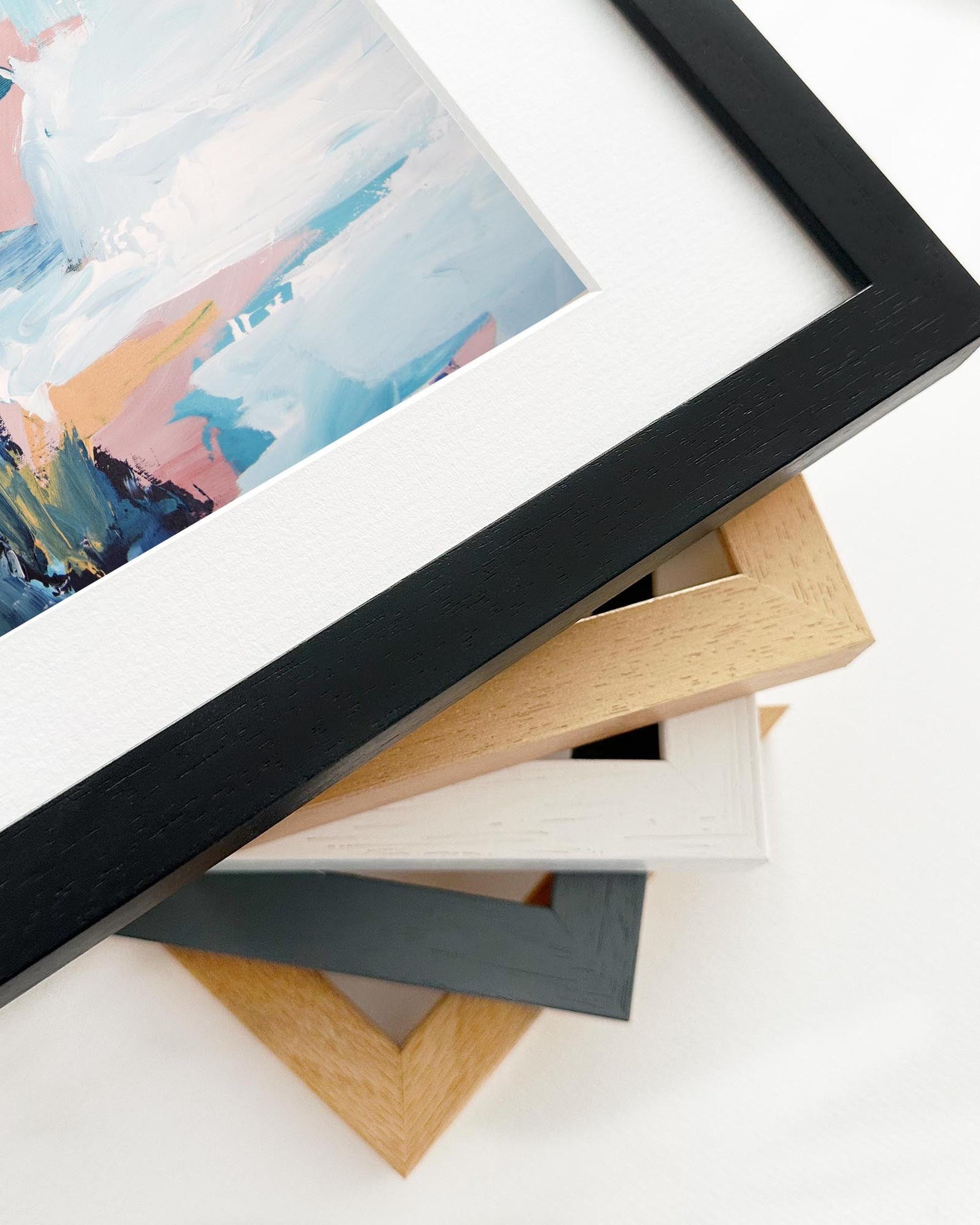 Collection of various photo frames on a white surface