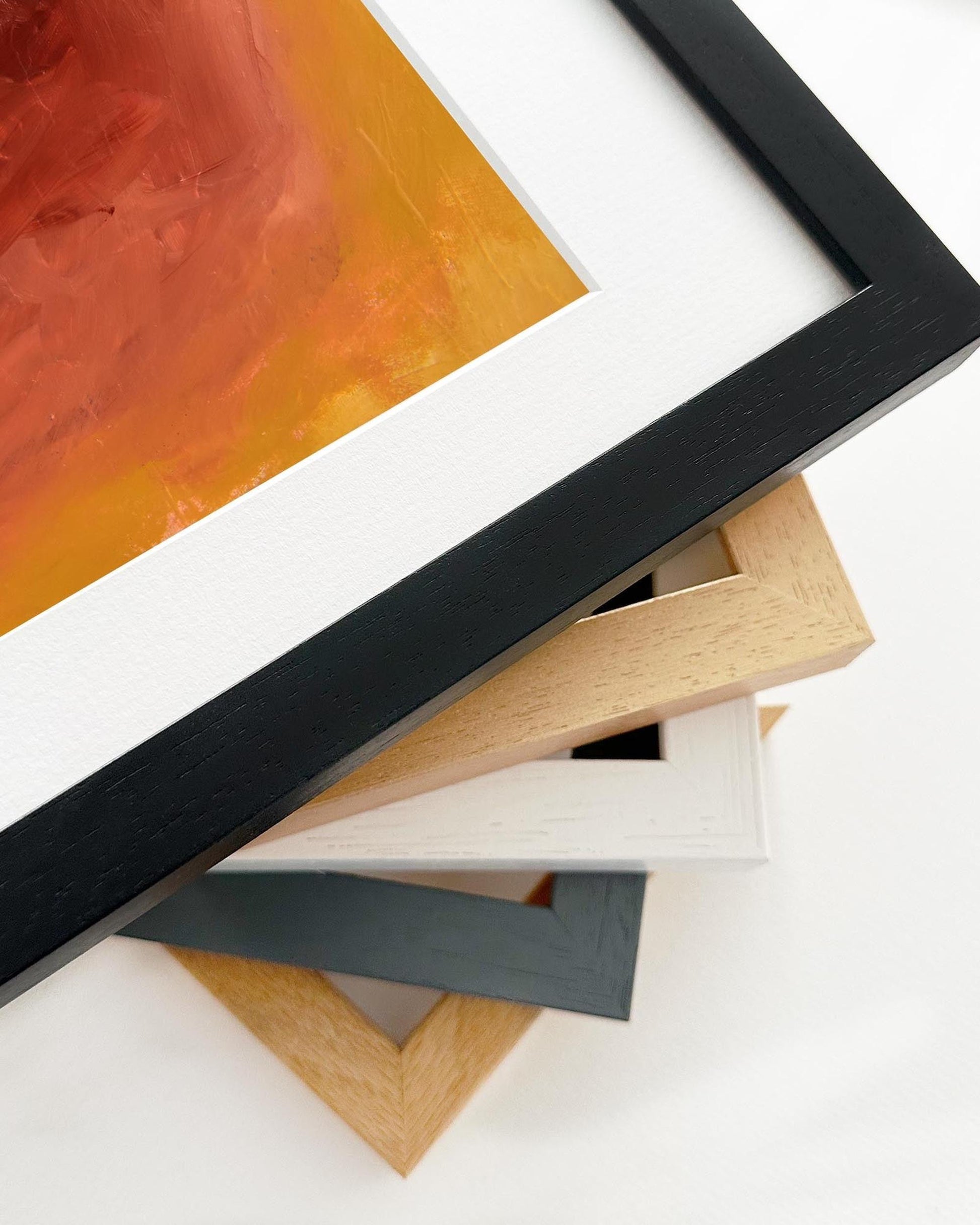 Collection of different colored picture frames on a white background