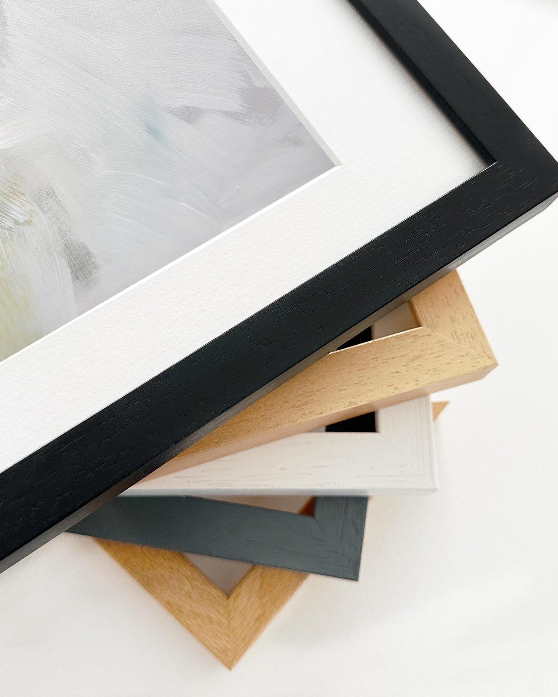 Collection of various photo frames on a white surface