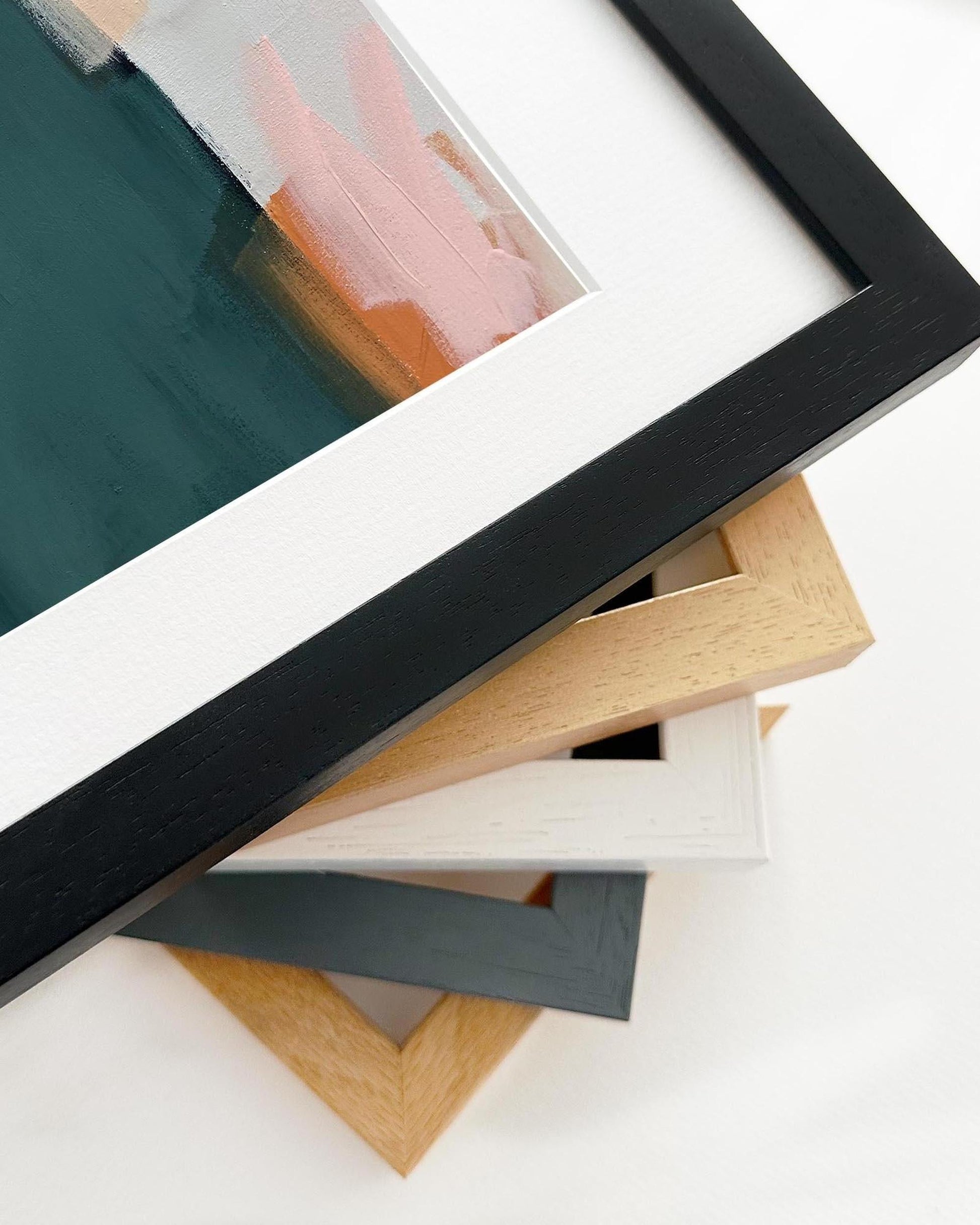 Stack of various photo frames on a white background