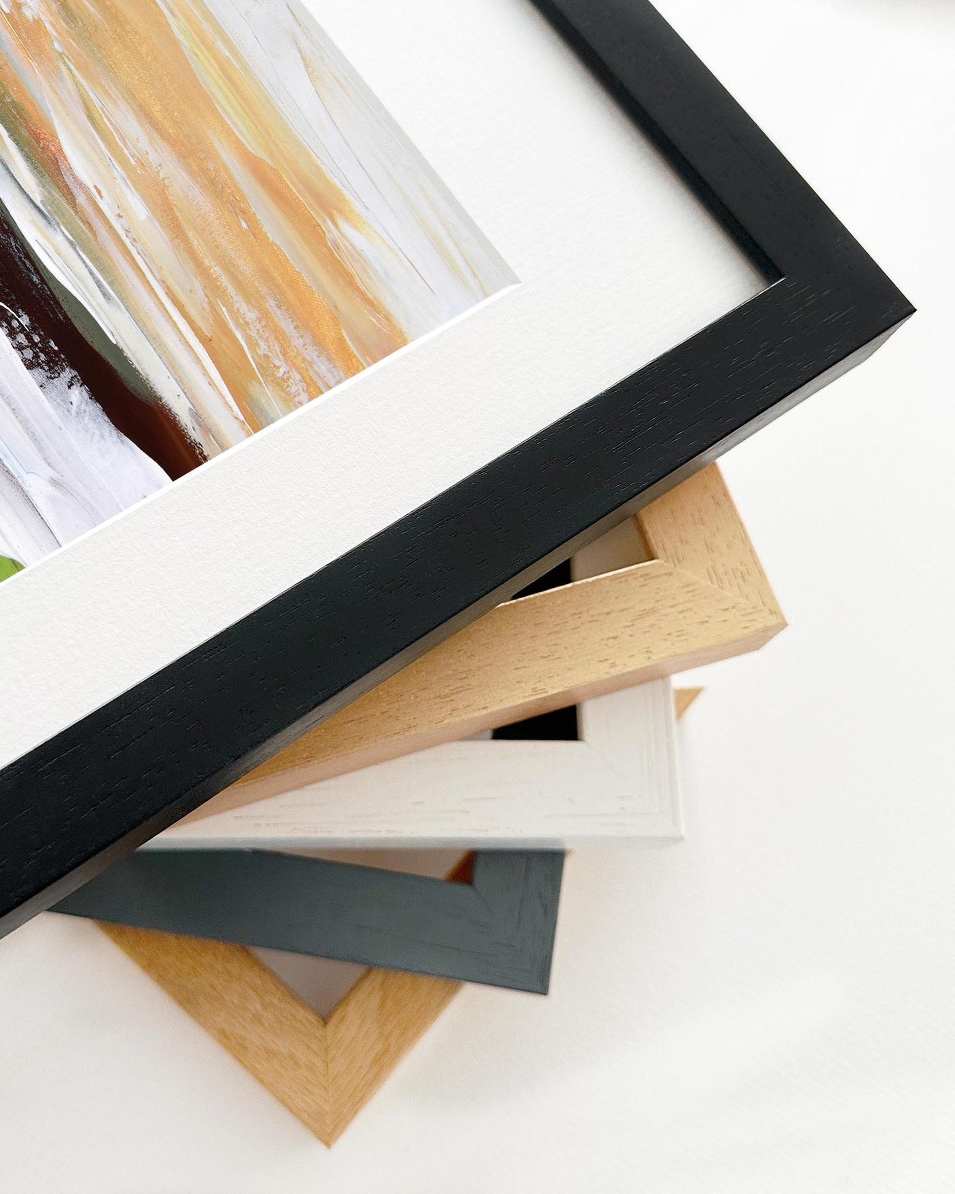 Stack of various photo frames on a white background