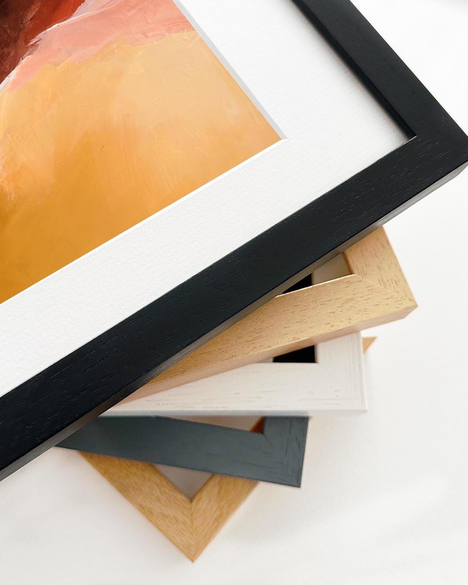 Stack of various photo frames on a white background