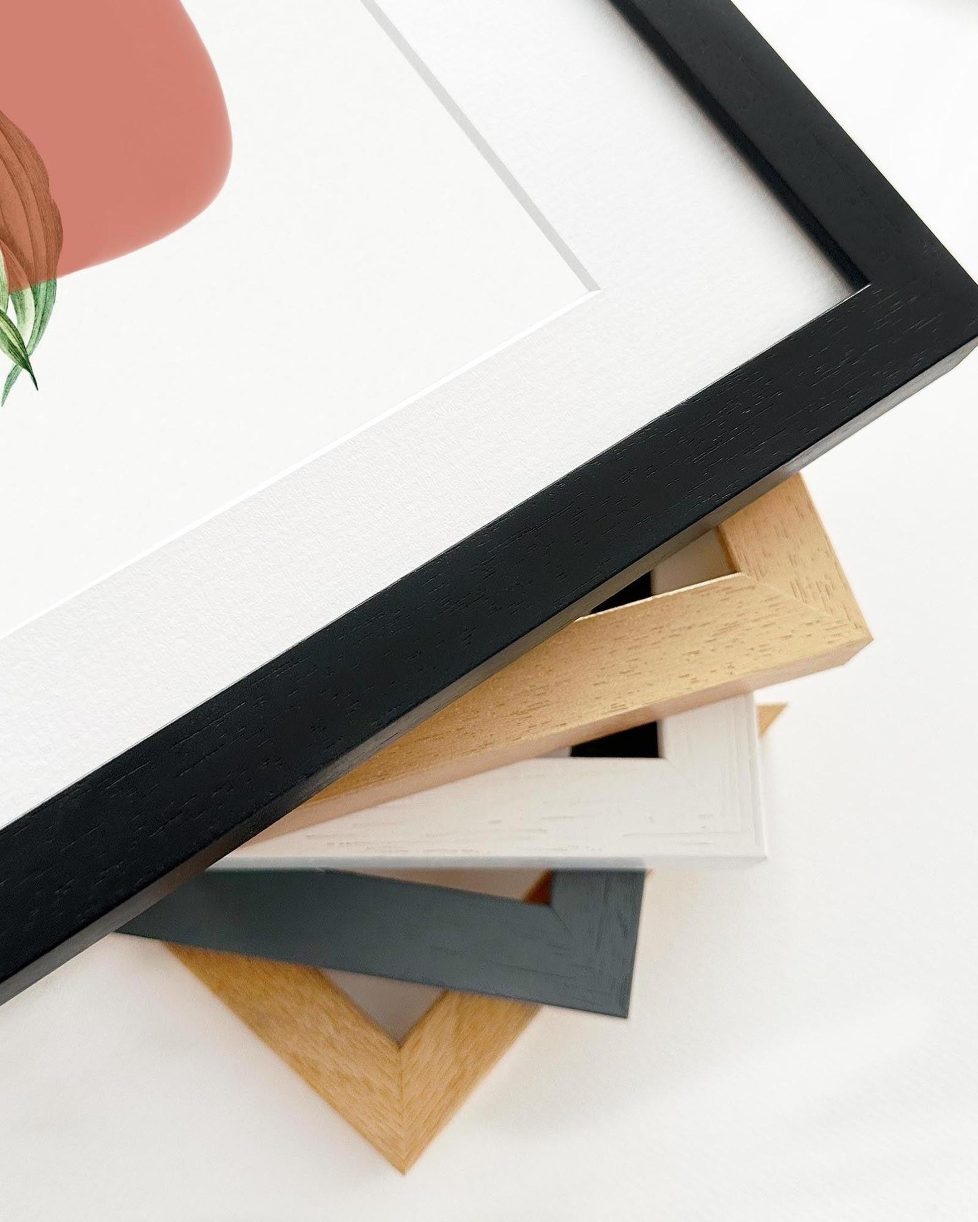 Collection of various wooden picture frames on a white background