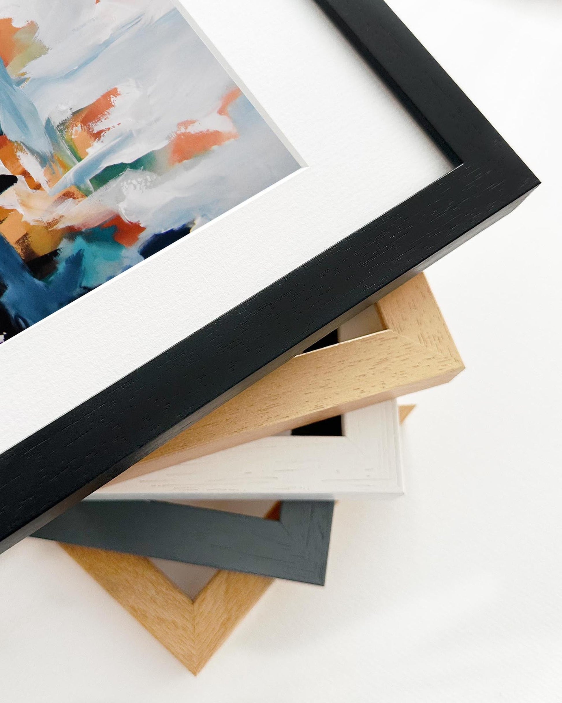 Stack of various photo frames on a white background