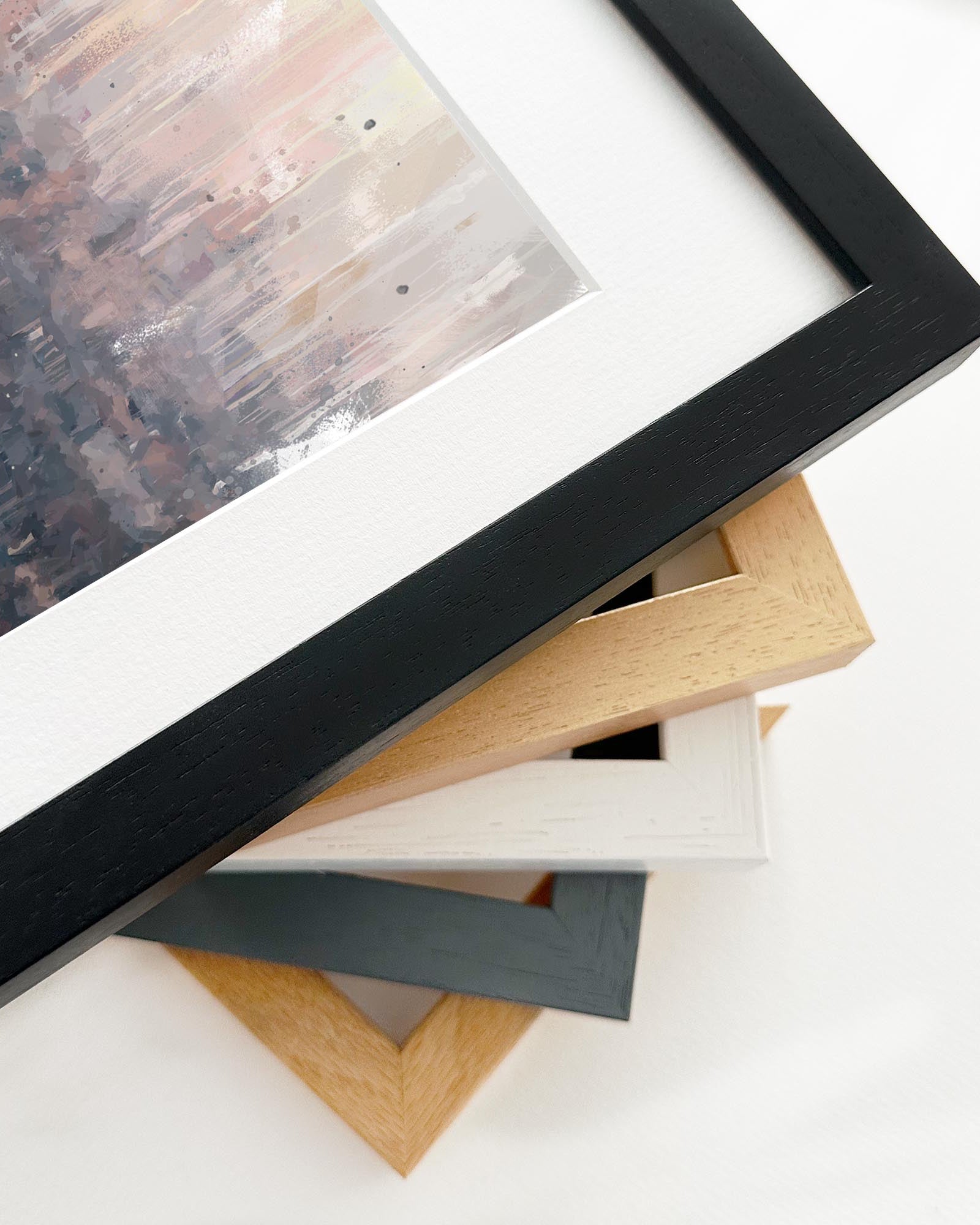 Close-up of various picture frames on a white surface