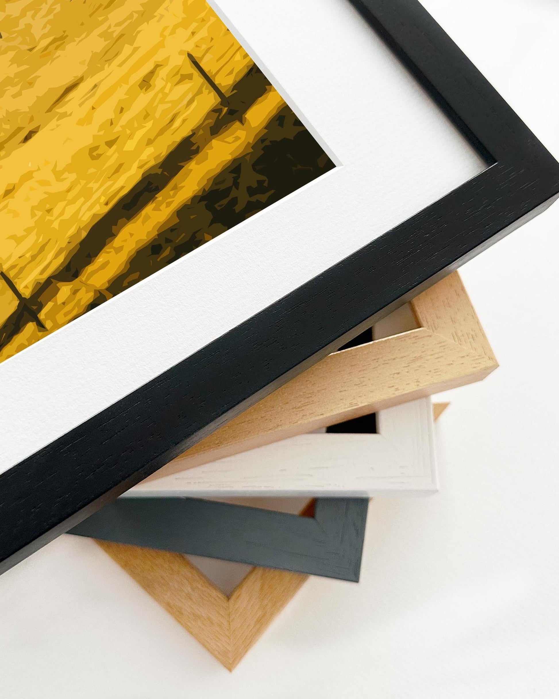 Stack of variously colored picture frames on a white background