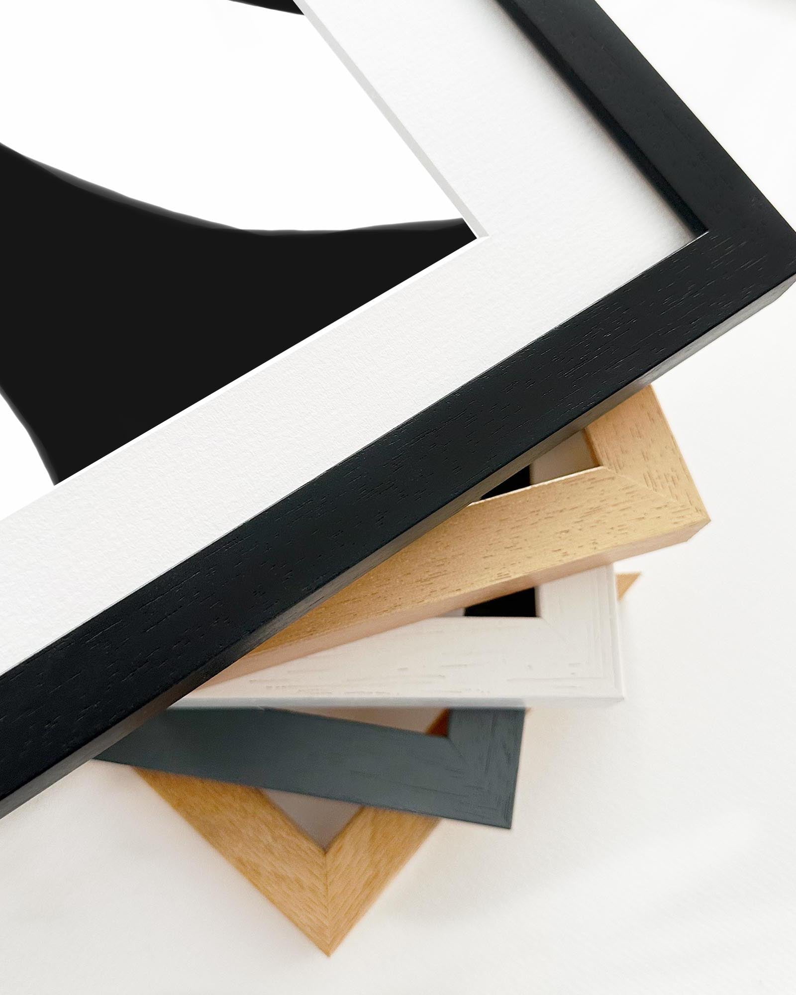 Collection of various photo frames in different colors and sizes on a white background