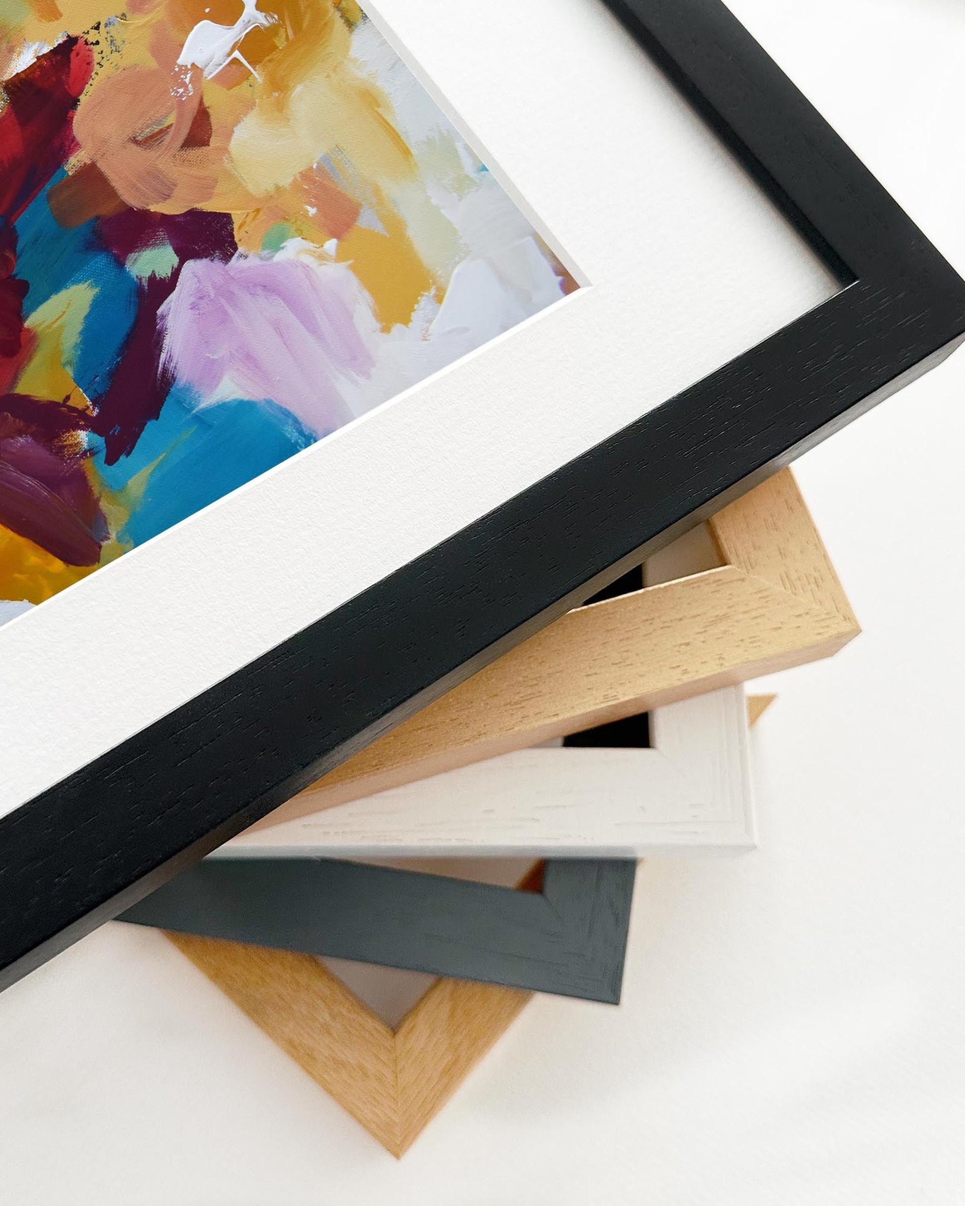 Colorful abstract painting with a black frame on a white background