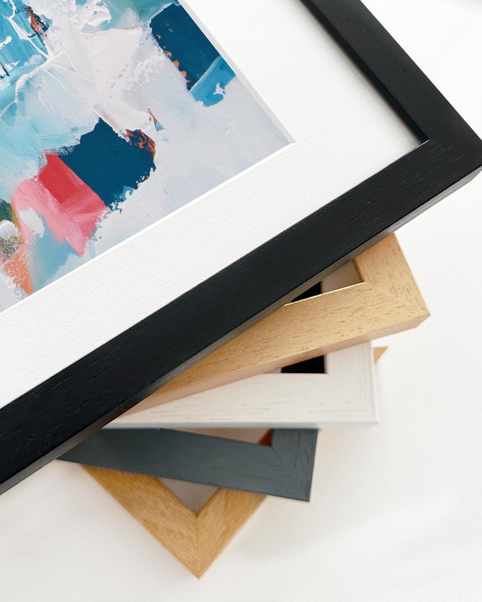 Stack of various photo frames on a white background