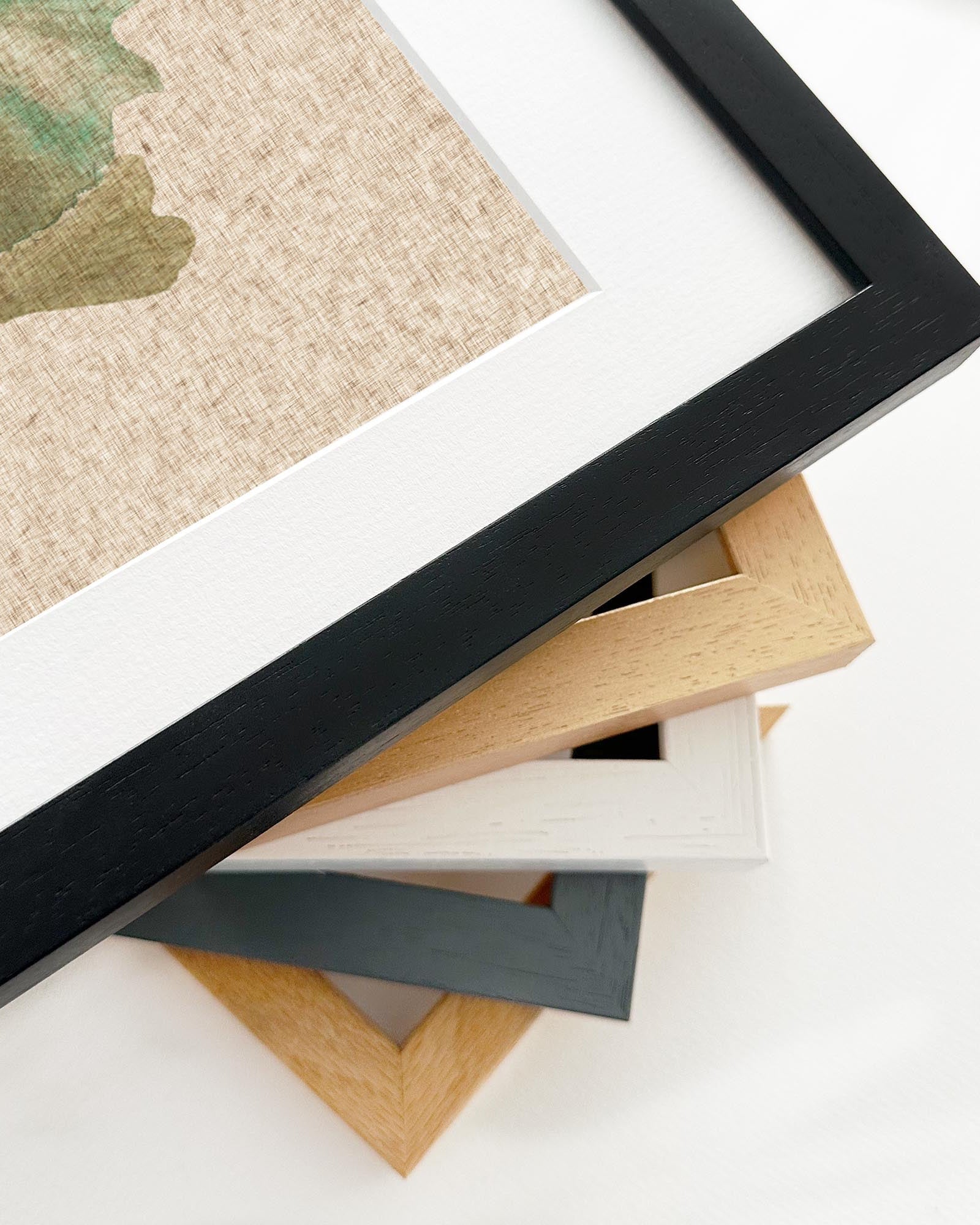 Close-up of various picture frames on a white surface