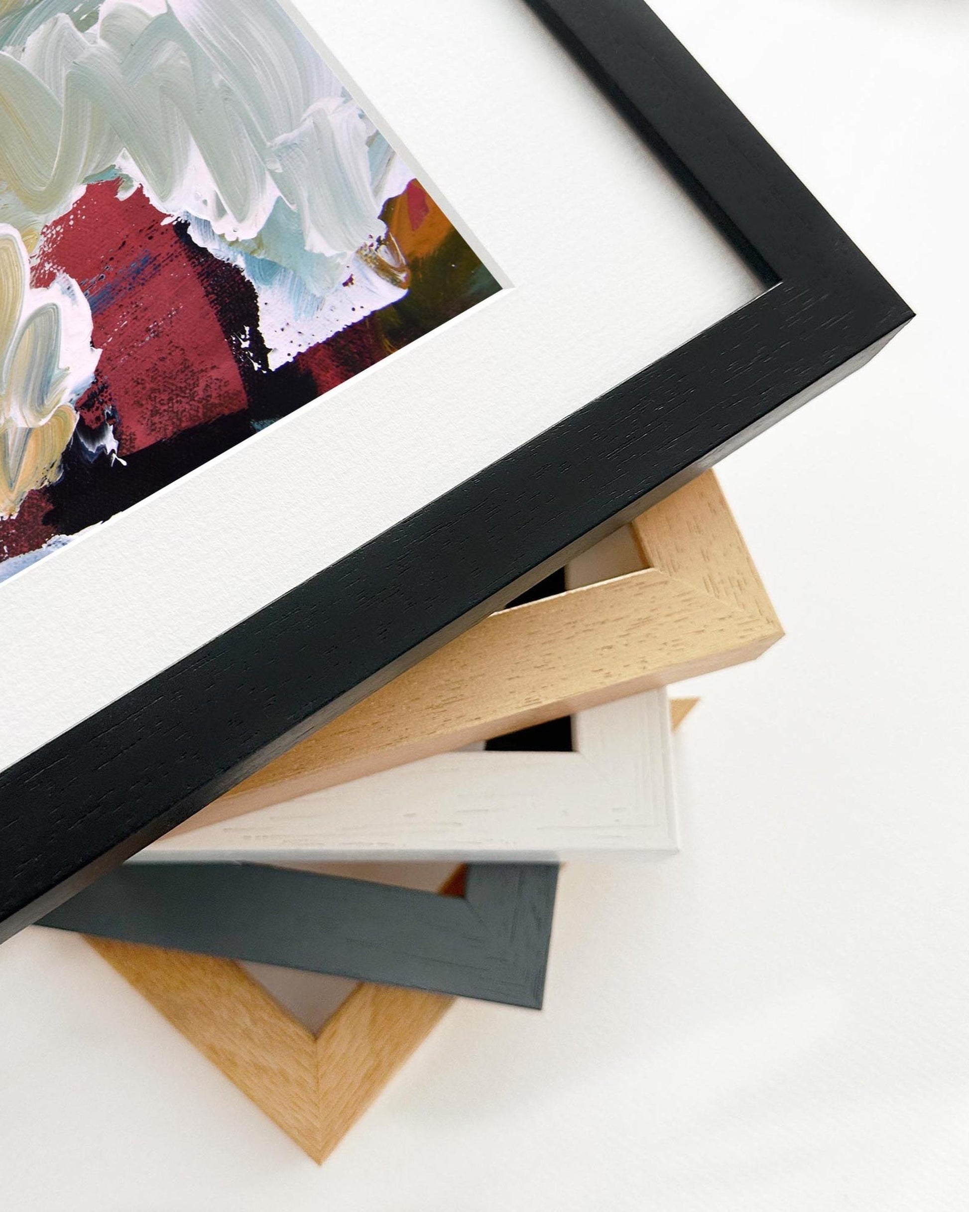 Stack of various photo frames on a white background