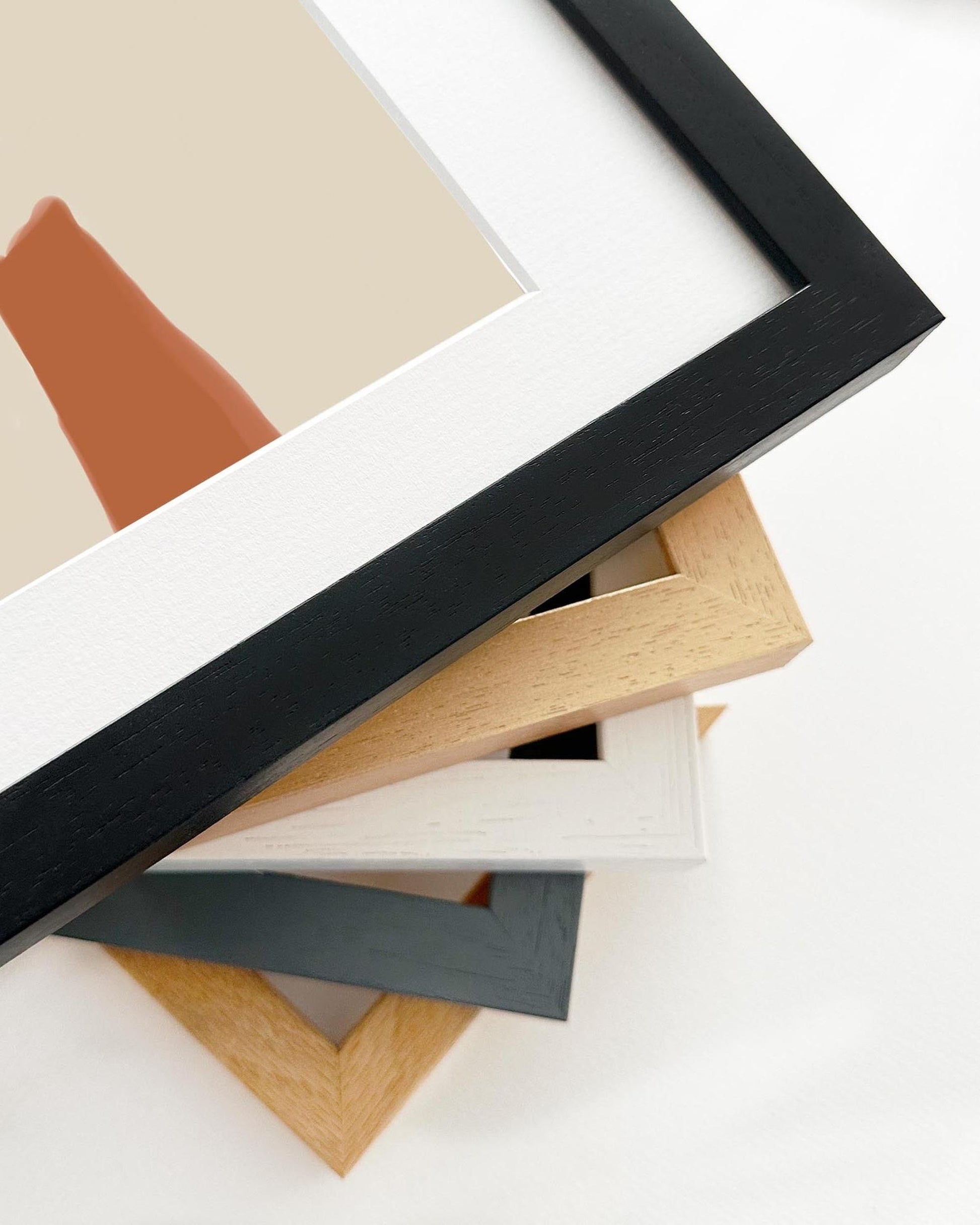 Stack of various photo frames on a white background