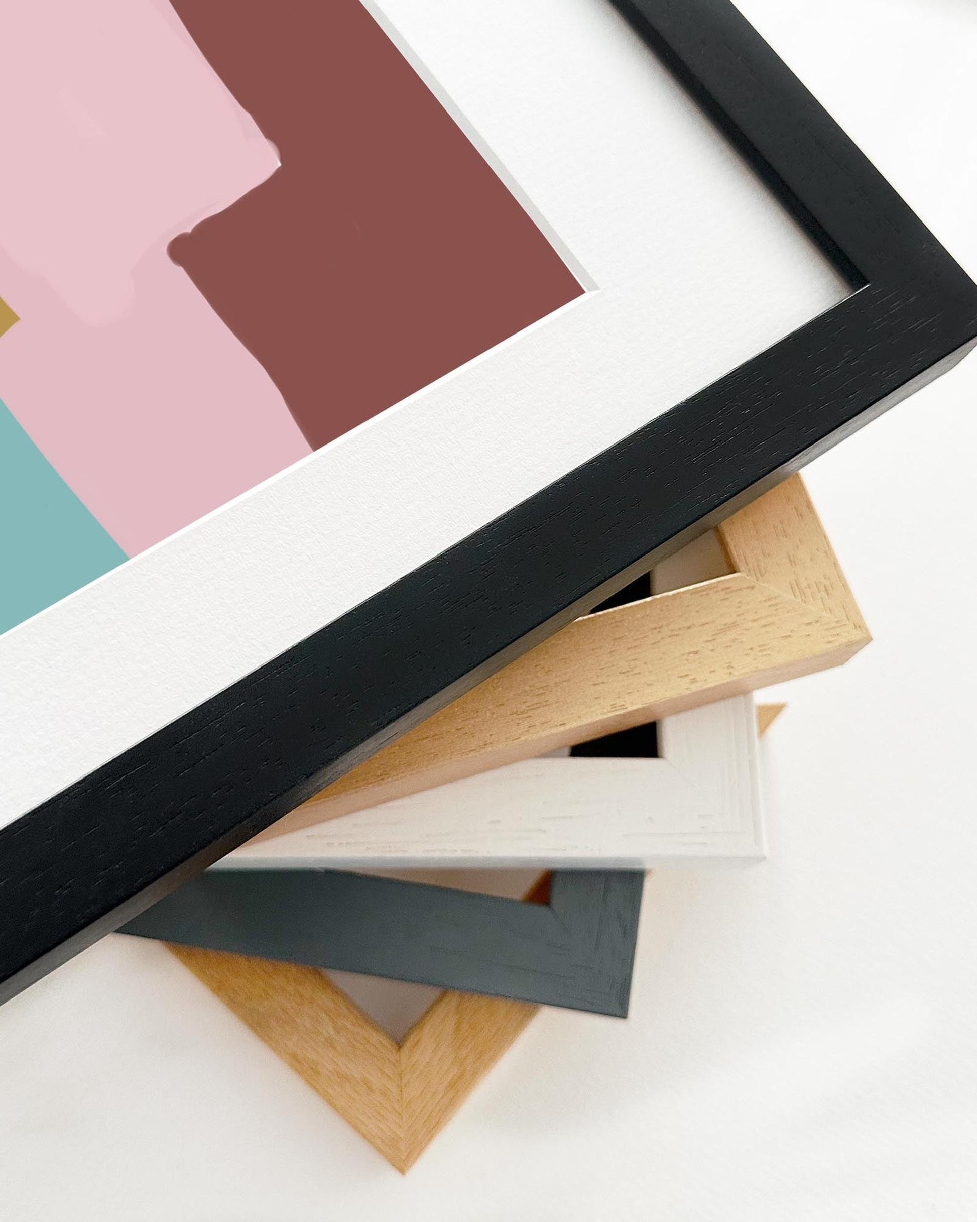 Collection of various photo frames with different colors and styles on a white background