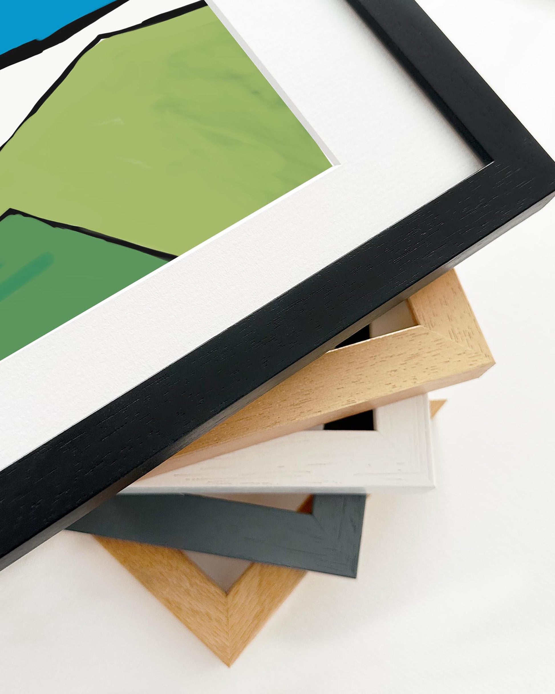 Collection of variously colored picture frames on a white background