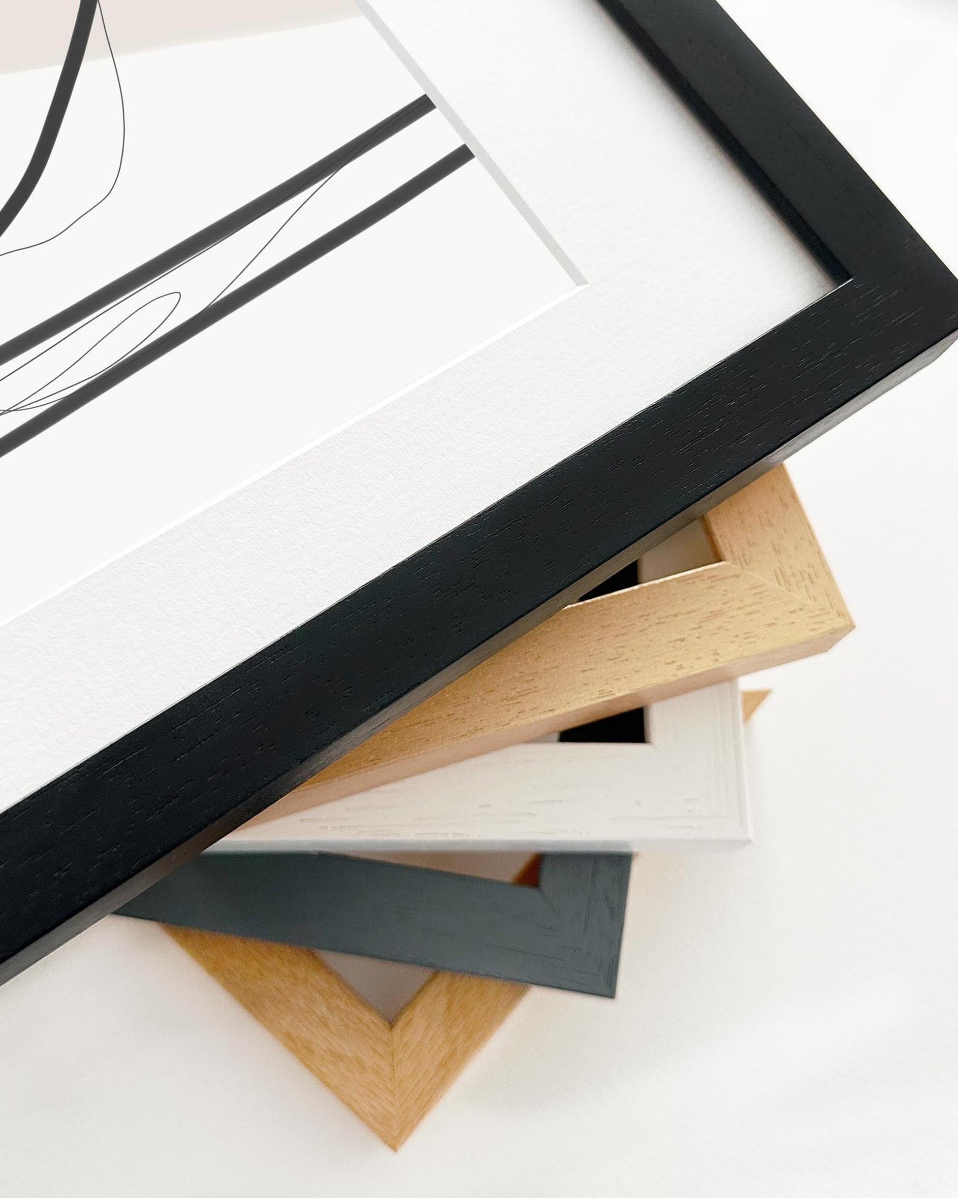 Collection of various photo frames on a white surface